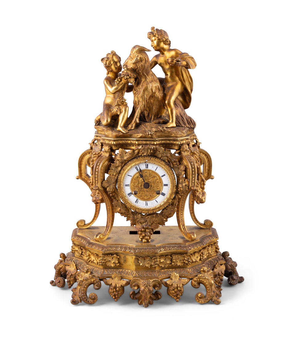 A FRENCH GILT METAL MANTEL CLOCK IN ROCOCO STYLE, 19TH CENTURY, the white enamel dial with Roman (1 of 6)