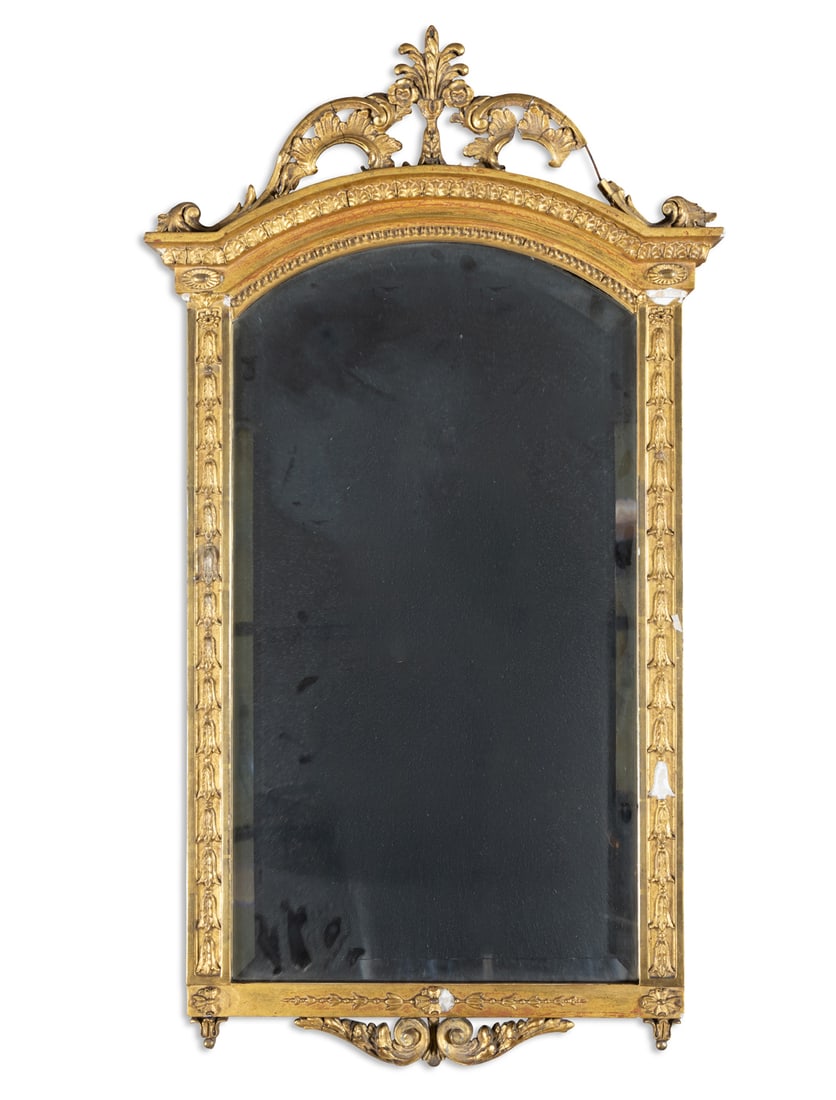 A CARVED GILTWOOD PIER MIRROR, LATE 19TH CENTURY arched pediment, surmounted with a acanthus leaf (1 of 4)
