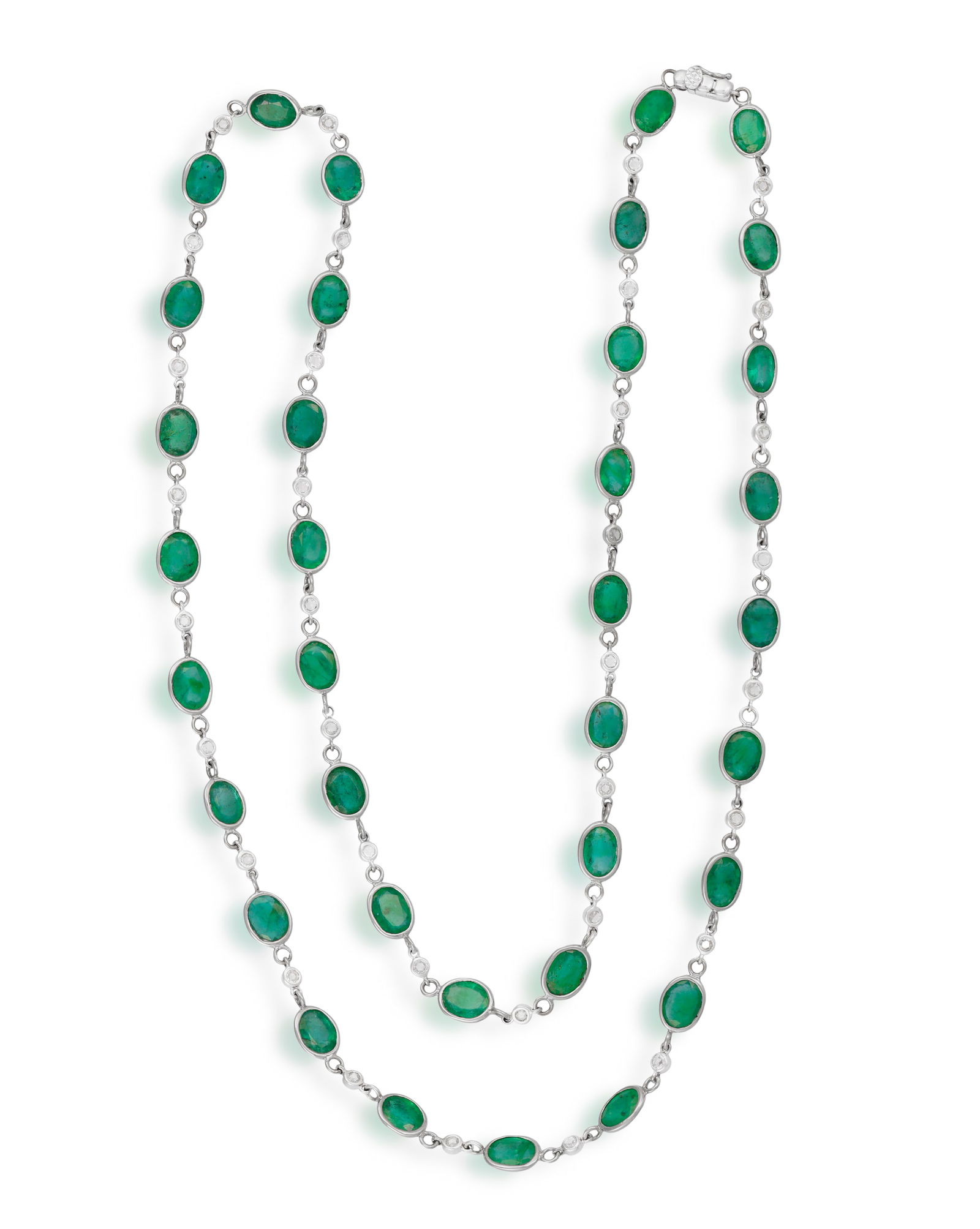 AN EMERALD AND DIAMOND LONGCHAIN NECKLACE Spectacle-set with cushion-shaped emeralds, between (1 of 3)
