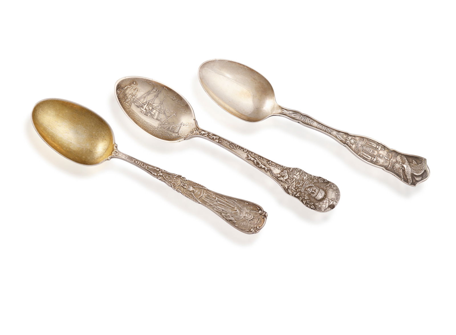 TIFFANY & CO.: A SILVER COMMEMORATIVE SPOON TOGETHER WITH TWO AMERICAN SILVER SPOONS The terminal w (1 of 2)