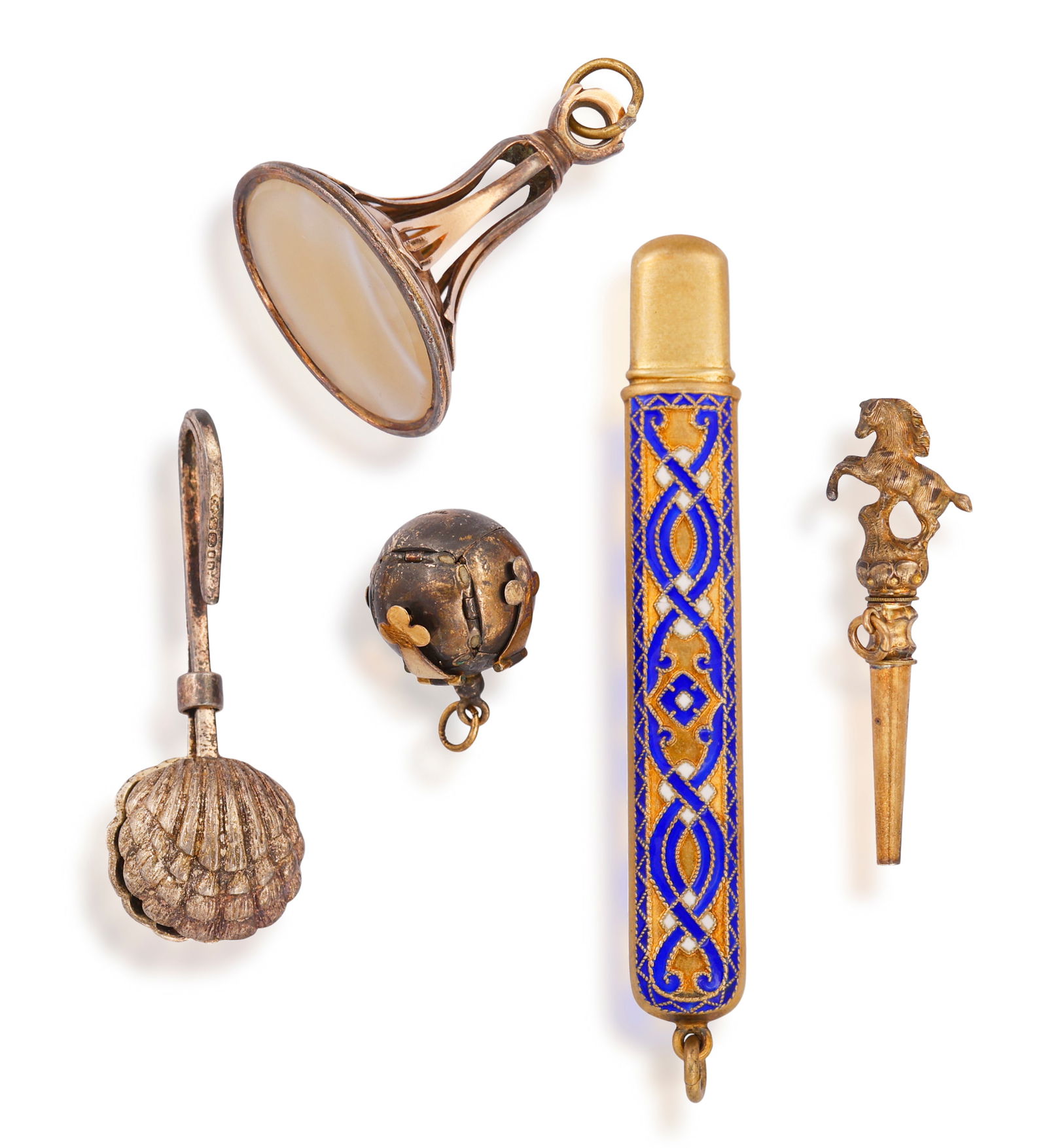 A GROUP OF OBJECTS Including: a seal set with an agate, length 4.3cm; a napkin holder in form of a (1 of 6)