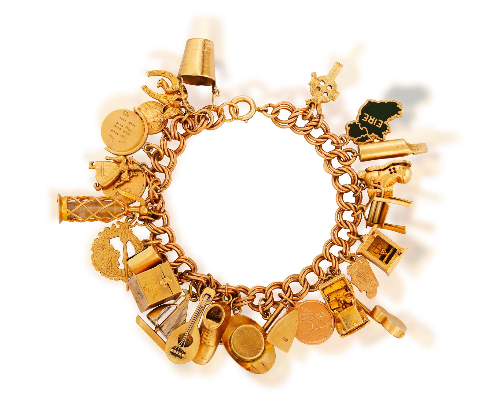 A GOLD CHARM BRACELET * fancy-link chain * twenty-seven various charms * in 9K gold * length 18.5cm (1 of 3)
