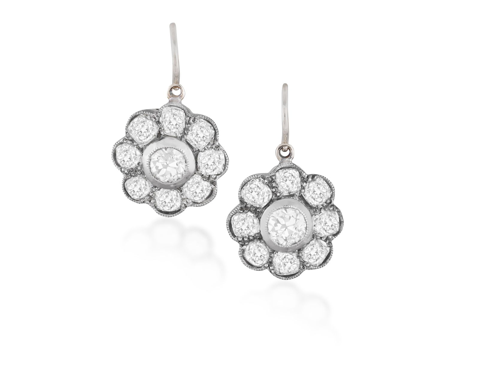 A PAIR OF DIAMOND PENDENT EARRINGS * of cluster design * old brilliant and cushion-cut diamonds, (1 of 2)