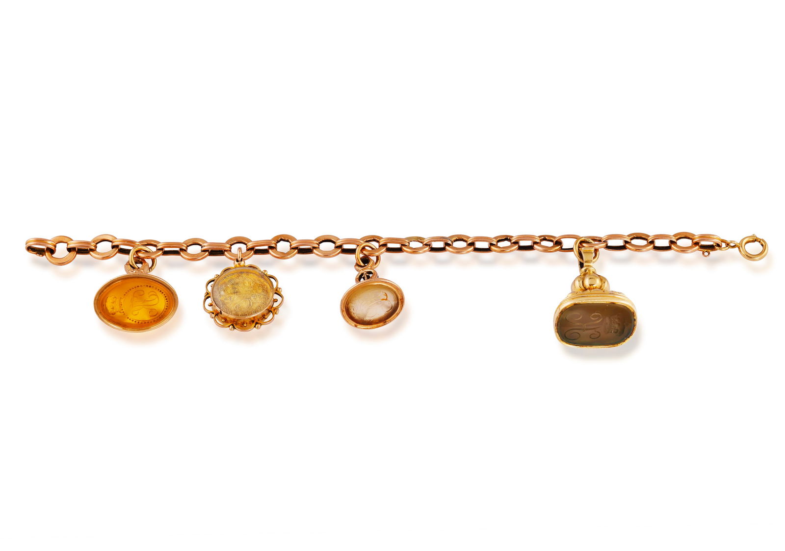 A GOLD CHARM BRACELET * cable-link chain * three chalcedony fob seal charms * one coin charm * in (1 of 3)