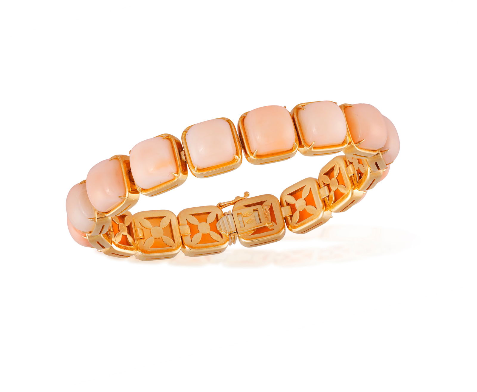A CORAL BRACELET * cushion-shaped coral cabochons * mounted in 18K gold * with maker’s mark * (1 of 4)