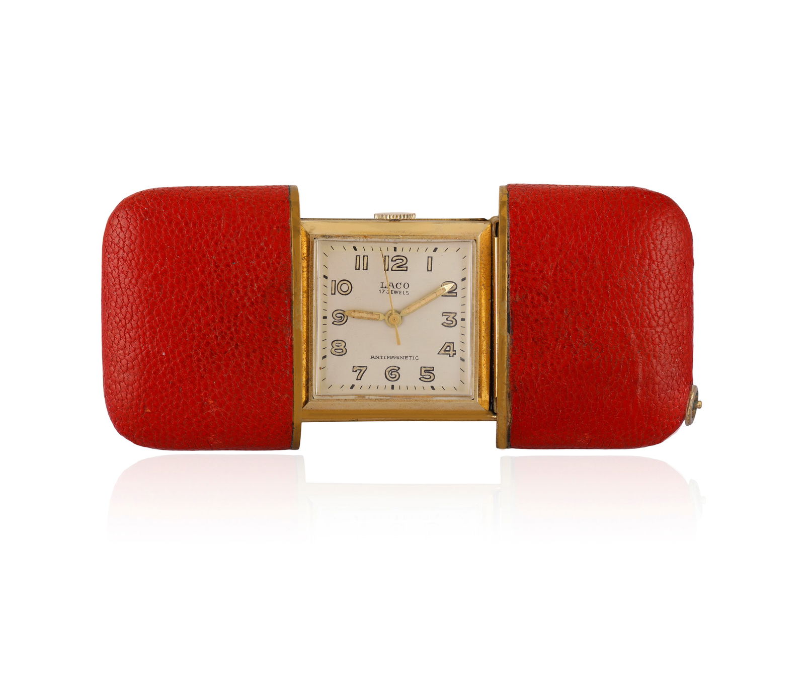 LACO: A RETRO TRAVEL CLOCK * manual wind movement * square dial * Arabic numerals * baton minute: LACO: A RETRO TRAVEL CLOCK * manual wind movement * square dial * Arabic numerals * baton minute markers * luminous numbers and hands * sliding red leather case * dial signed Laco * gold plated * widt