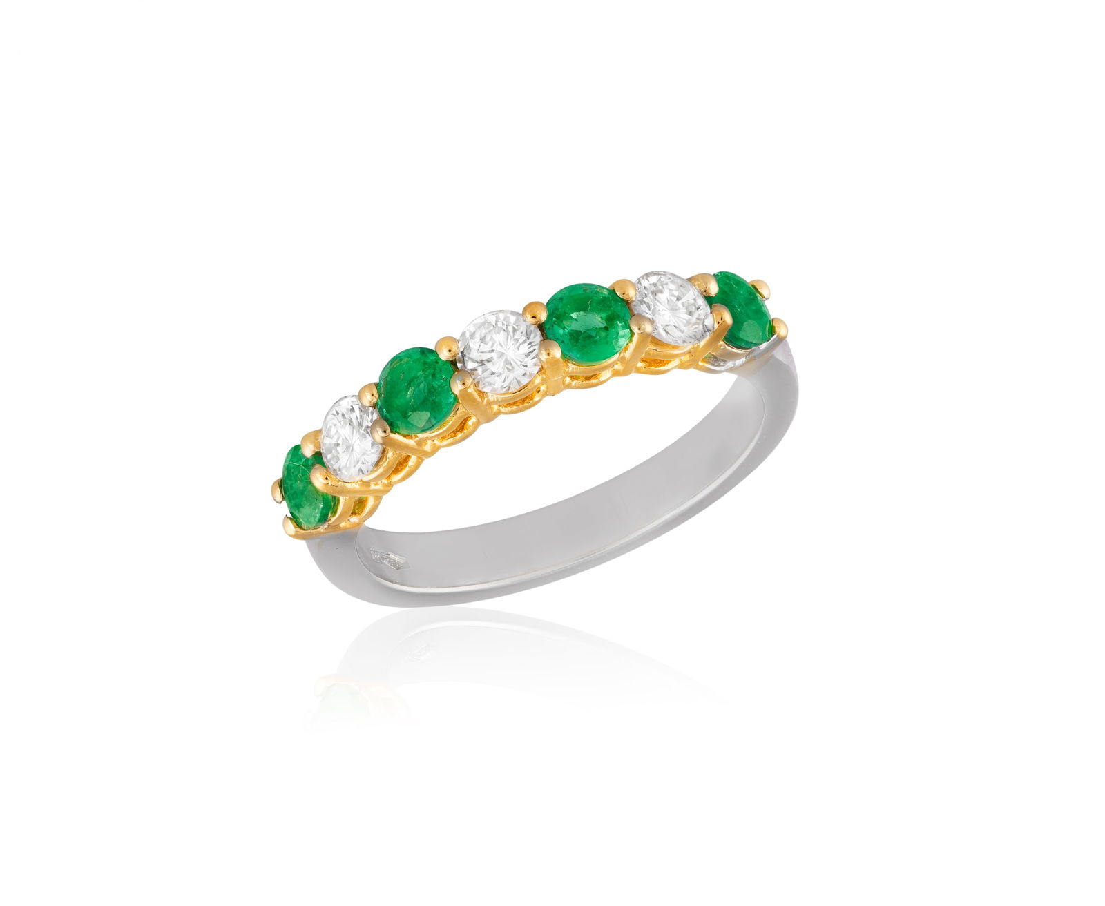 AN EMERALD AND DIAMOND HALF-ETERNITY RING * four circular-cut emeralds * three brilliant-cut (1 of 3)