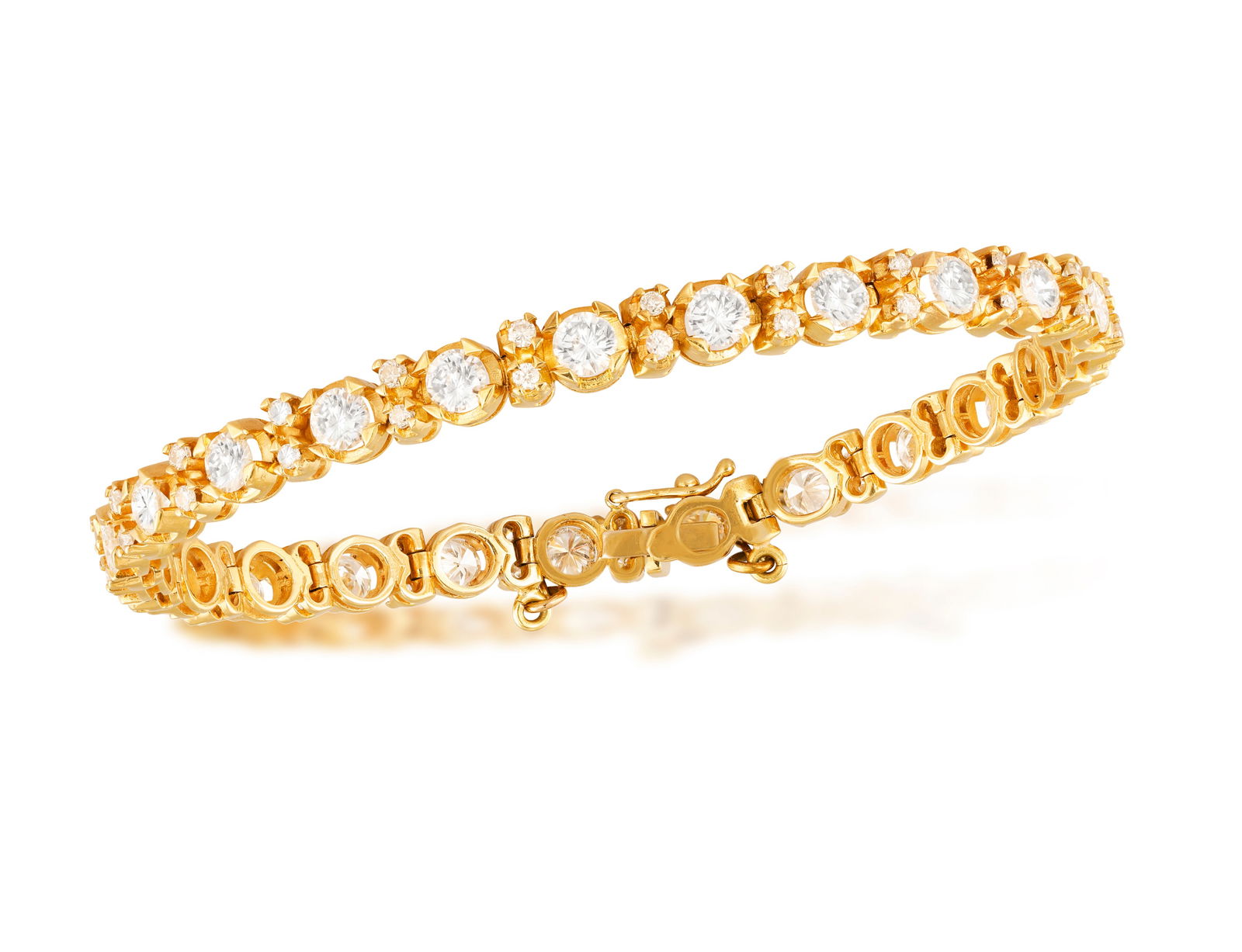 A DIAMOND LINE BRACELET * brilliant-cut diamonds, approx. 5.50cts total * mounted in 18K gold * with (1 of 2)