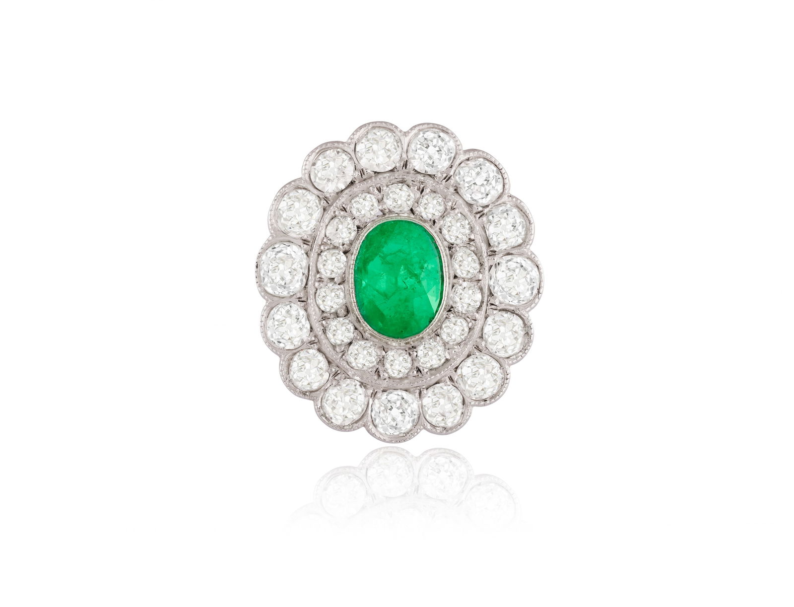 AN EMERALD AND DIAMOND CLUSTER RING * an oval-shaped emeralds * old brilliant-cut diamonds, approx. (1 of 3)
