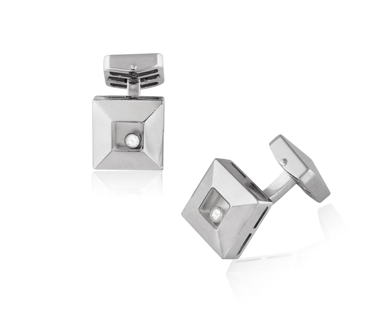 CHOPARD: A PAIR OF ‘HAPPY DIAMONDS’ CUFFLINKS * two brilliant-cut diamonds * mounted in (1 of 2)