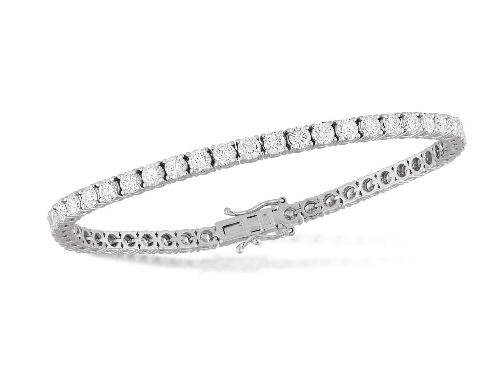 A DIAMOND LINE BRACELET * brilliant-cut diamonds, approx. 6.20cts total * mounted in 18K gold * (1 of 3)