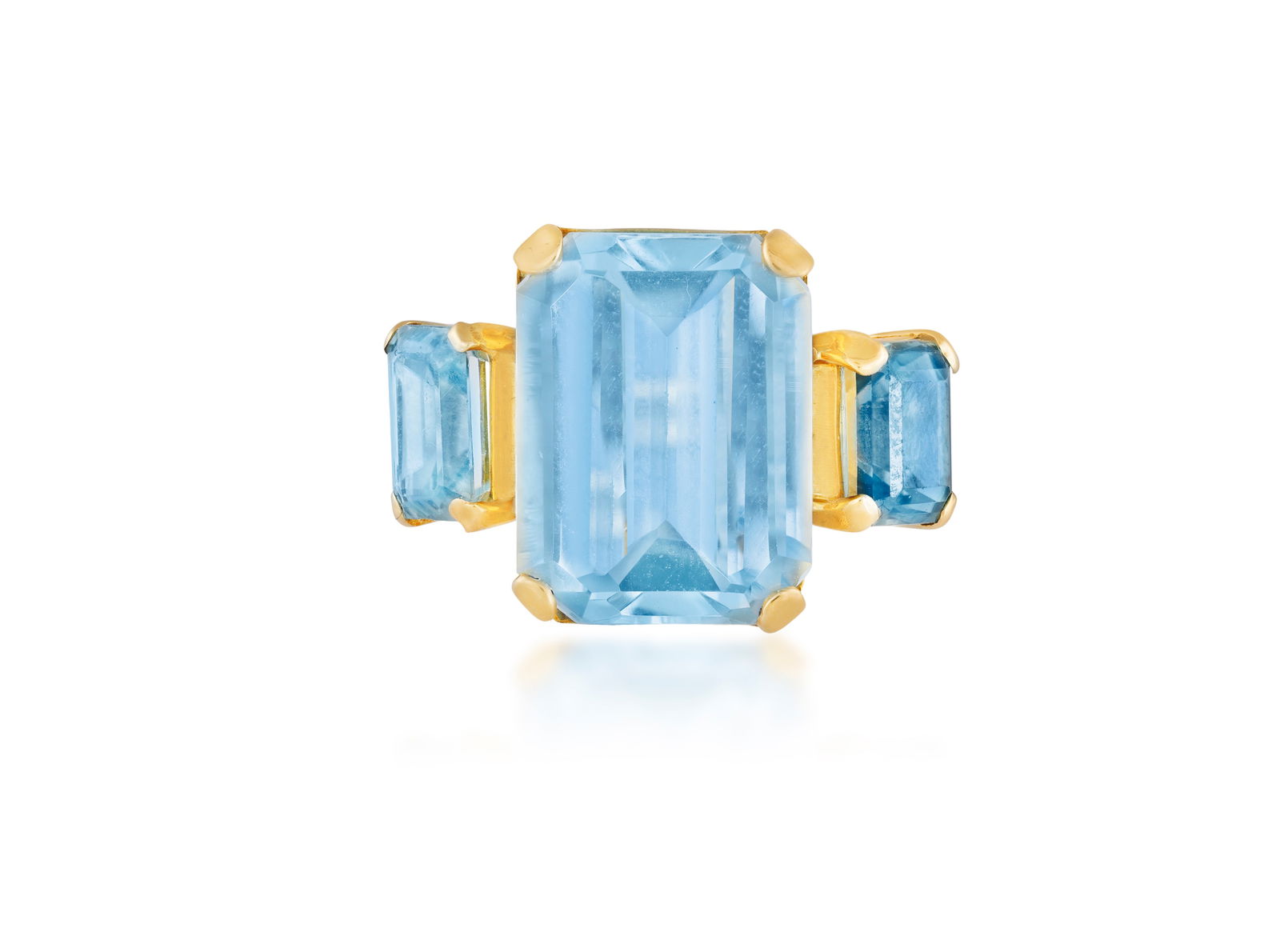 A TOPAZ AND ZIRCON DRESS RING * a rectangular-cut topaz, approx. 14.50cts * two rectangular-cut: A TOPAZ AND ZIRCON DRESS RING * a rectangular-cut topaz, approx. 14.50cts * two rectangular-cut zircons, approx. 3.10cts total * mounted in 18K gold * ring size M_