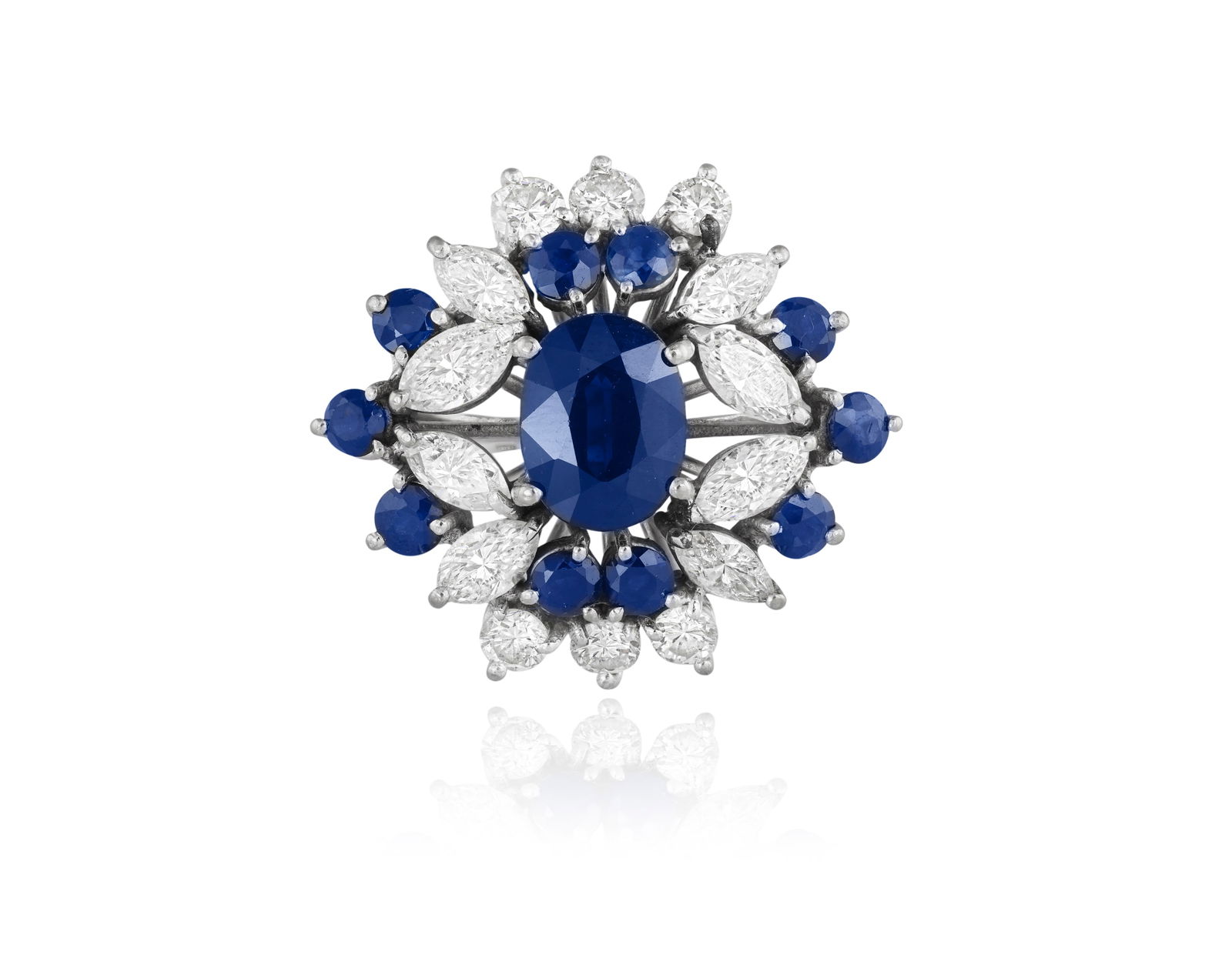 A SAPPHIRE AND DIAMOND CLUSTER RING * one cushion-shaped sapphire, approx. 2.30cts * circular-cut (1 of 4)