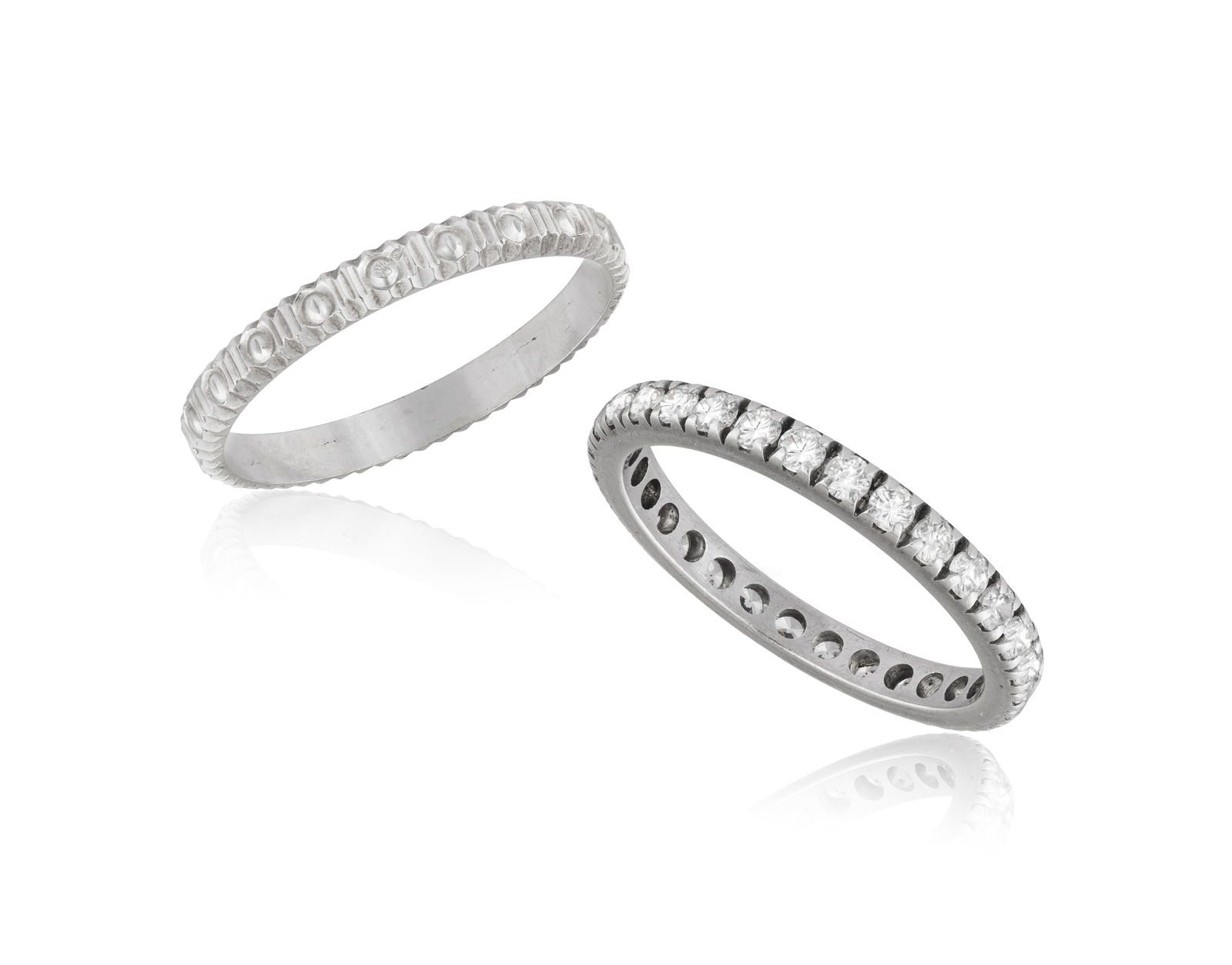 TWO RINGS * one full-eternity band * circular-cut colourless stones * mounted in silver * ring size (1 of 2)