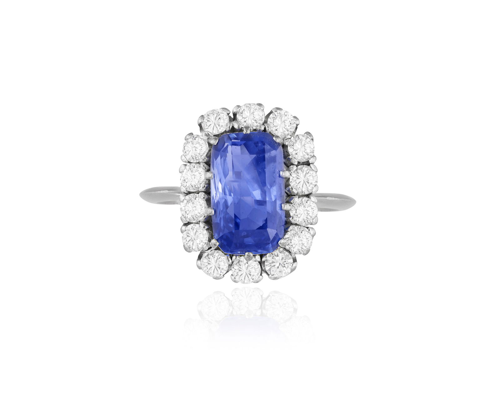 A SAPPHIRE AND DIAMOND CLUSTER RING * one rectangular-shaped sapphire * brilliant-cut diamonds * (1 of 4)