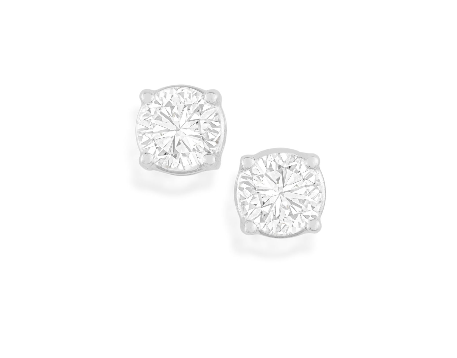 A PAIR OF DIAMOND EARSTUDS * two brilliant-cut diamonds, approx. 0.70ct total * mounted in 18K gold (1 of 2)