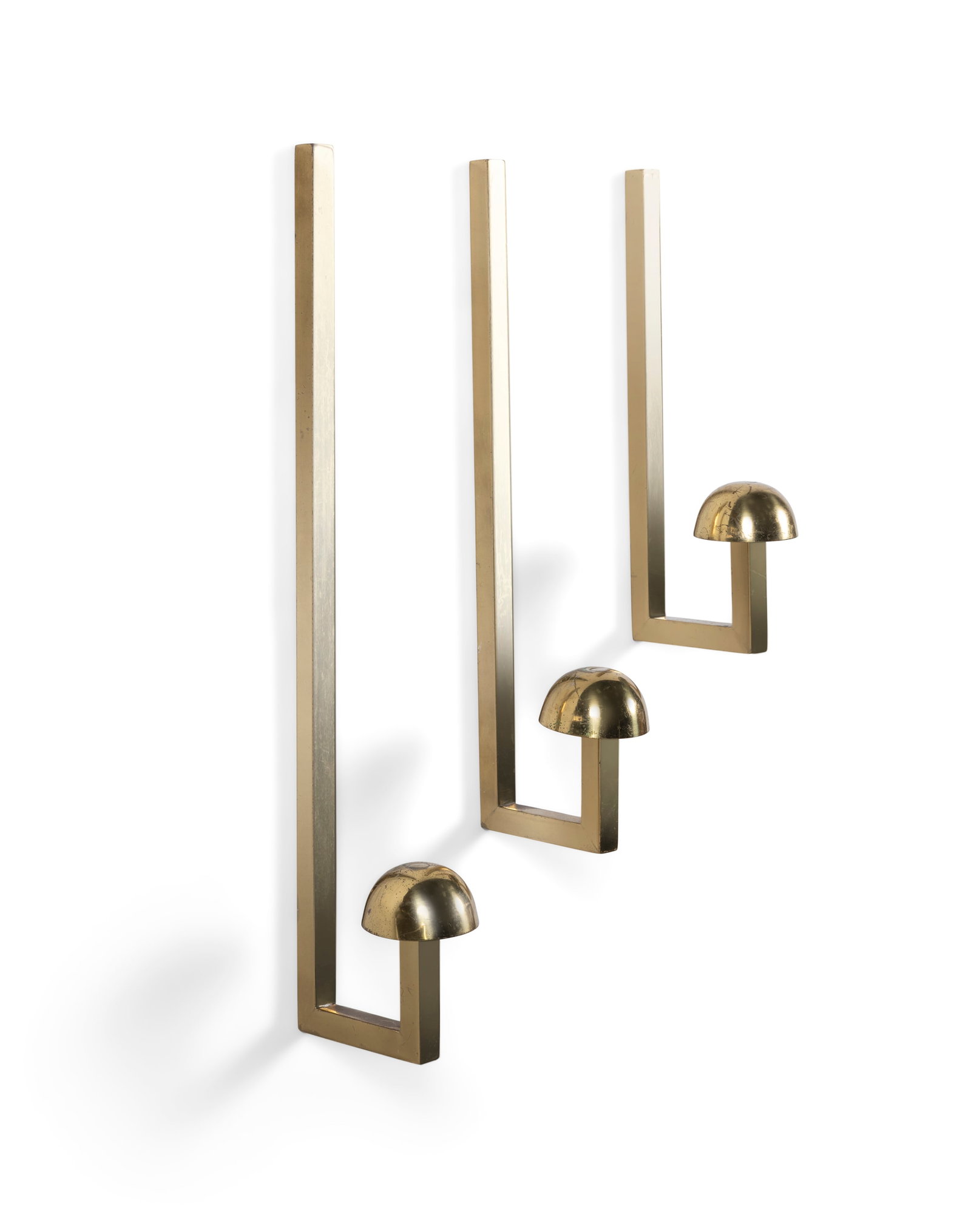 COAT HOOKS A set of three brass coat hooks. Italy, c.1970. 50cm x 40cm x 30cm(h): COAT HOOKS A set of three brass coat hooks. Italy, c.1970. 50cm x 40cm x 30cm(h)