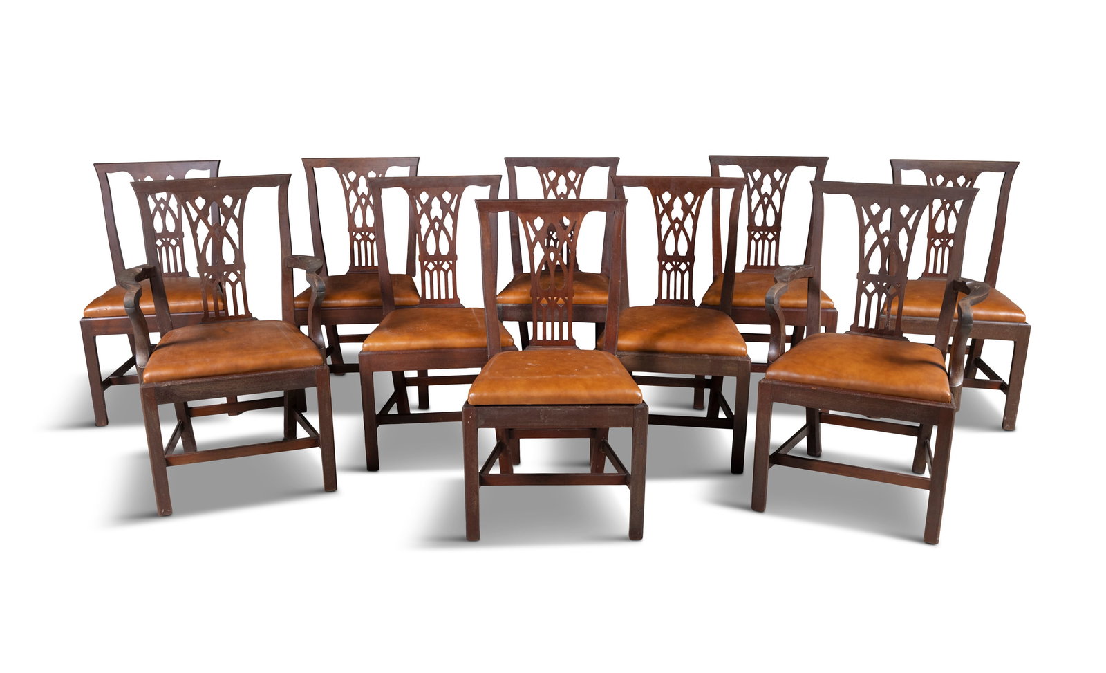 A SET OF TEN IRISH MAHOGANY DINING CHAIRS IN THE MANNER OF HICKS, comprising two carvers and eight (1 of 7)