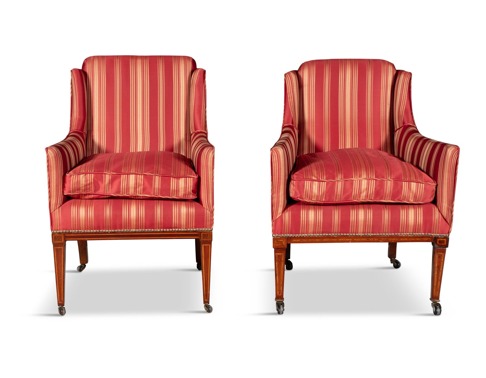 A PAIR OF EDWARDIAN MAHOGANY UPHOLSTERED DRAWING ROOM ARMCHAIRS, each with raised angular backs (1 of 3)