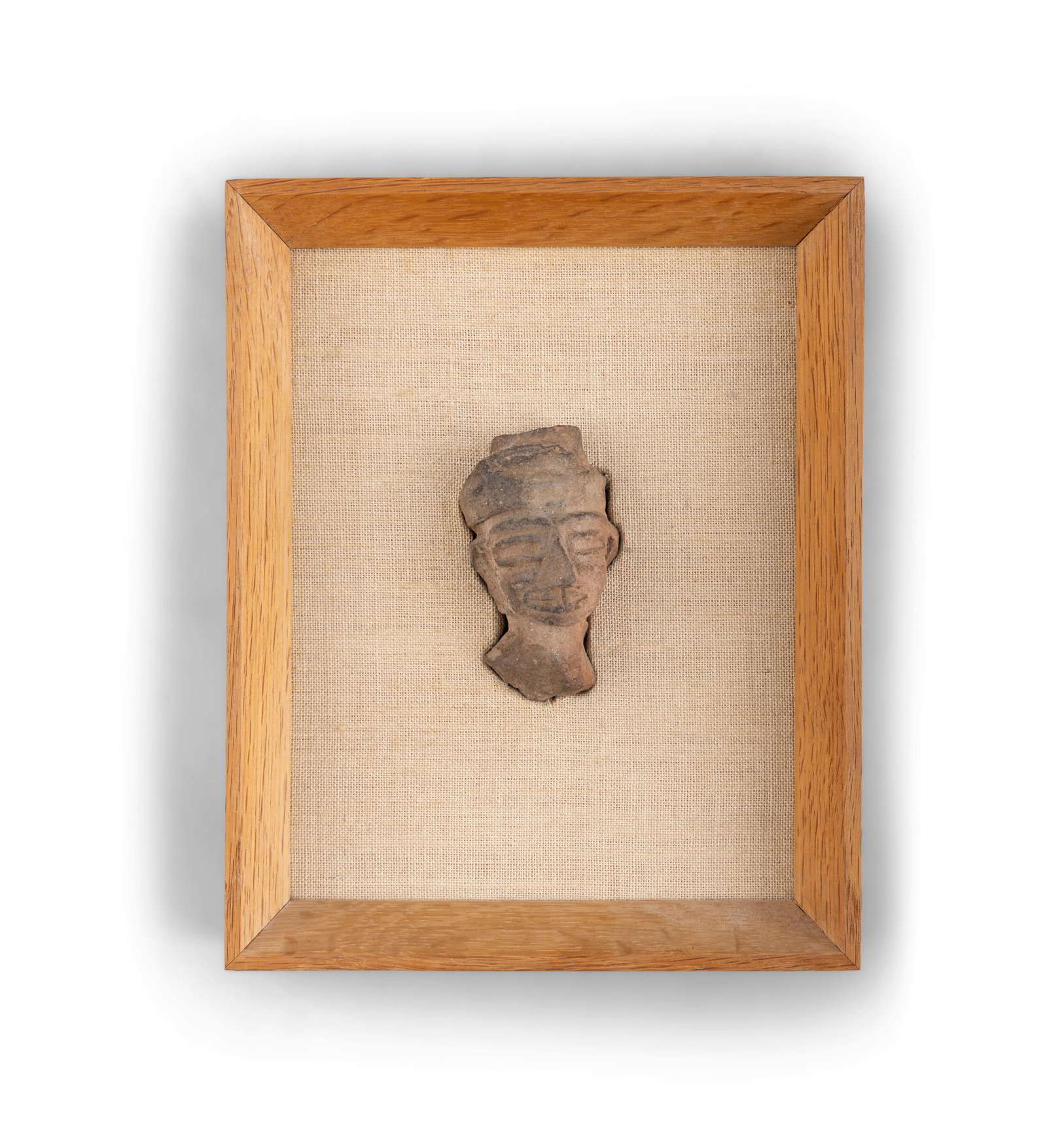 A PRE-COLUMBIAN CLAY HEAD FRAGMENT Mounted on a linen frame, with Ritchie Hendriks Gallery, Dublin (1 of 4)