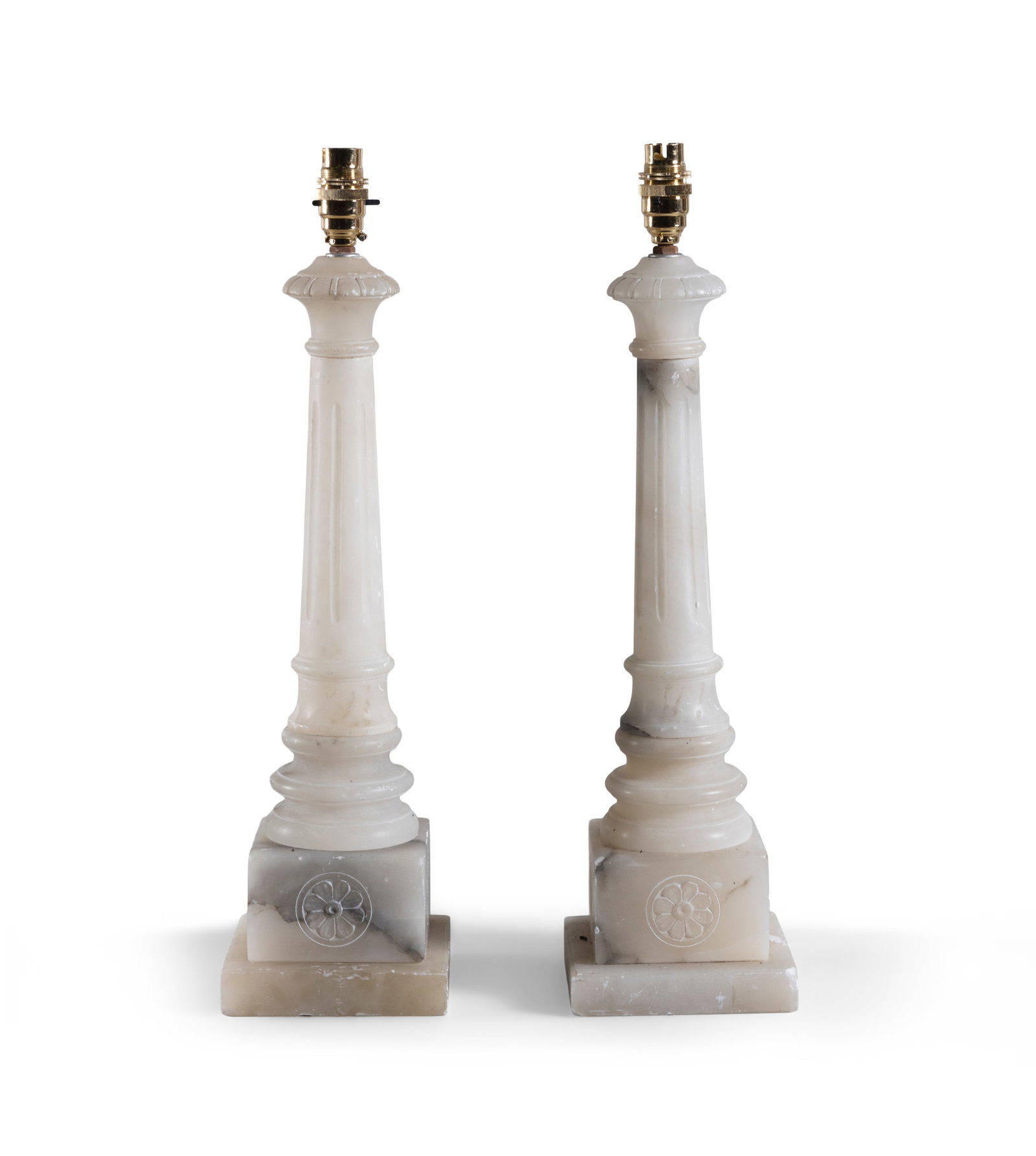 A PAIR OF CARVED ALABASTER TABLE LAMPS (E) on square pedestal bases. Each 53cm high ELECTRICAL (1 of 5)