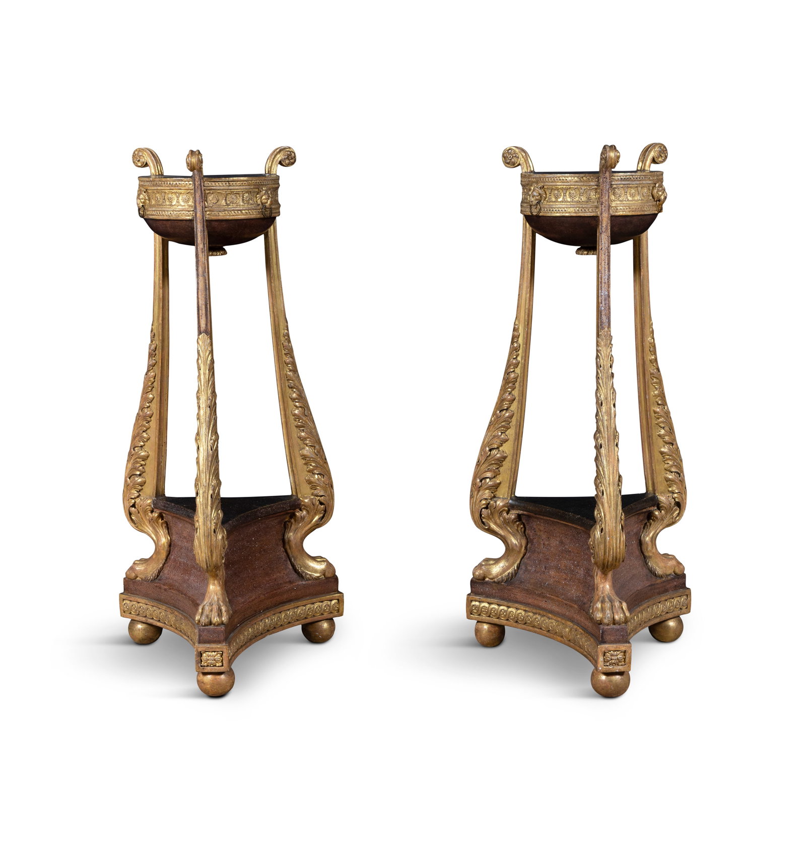 A PAIR OF GILTWOOD AND SIMULATED PORPHYRY TORCHERE STANDS IN THE MANNER OF FRANCOIS HERVE, each: A PAIR OF GILTWOOD AND SIMULATED PORPHYRY TORCHERE STANDS IN THE MANNER OF FRANCOIS HERVE, each with circular top, raised on three acanthus carved supports terminating with paw feet, on triform base a