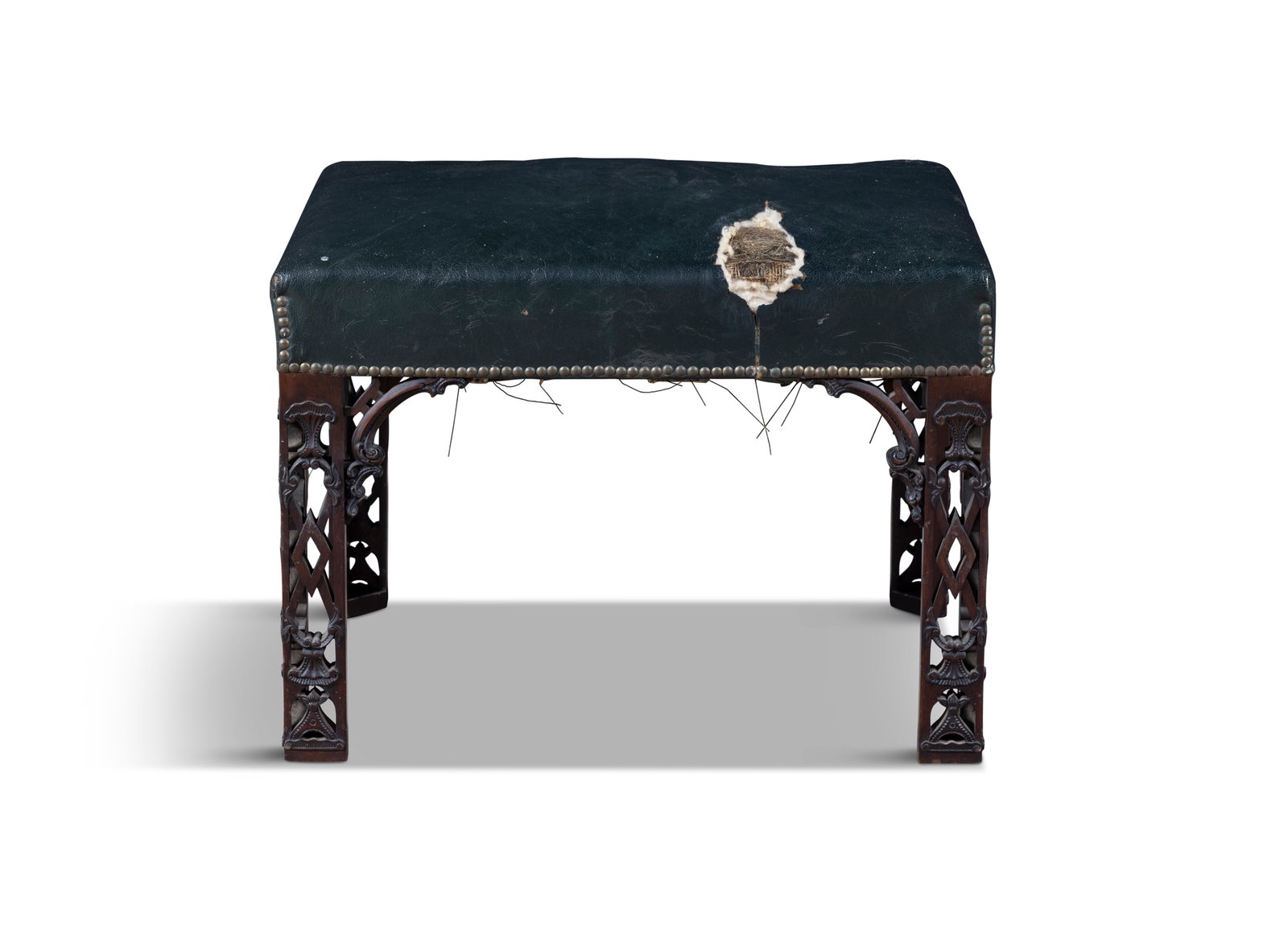 AN 18TH CENTURY MAHOGANY FRAMED STOOL IN THE MANNER OF CHIPPENDALE, of rectangular form the padded (1 of 4)