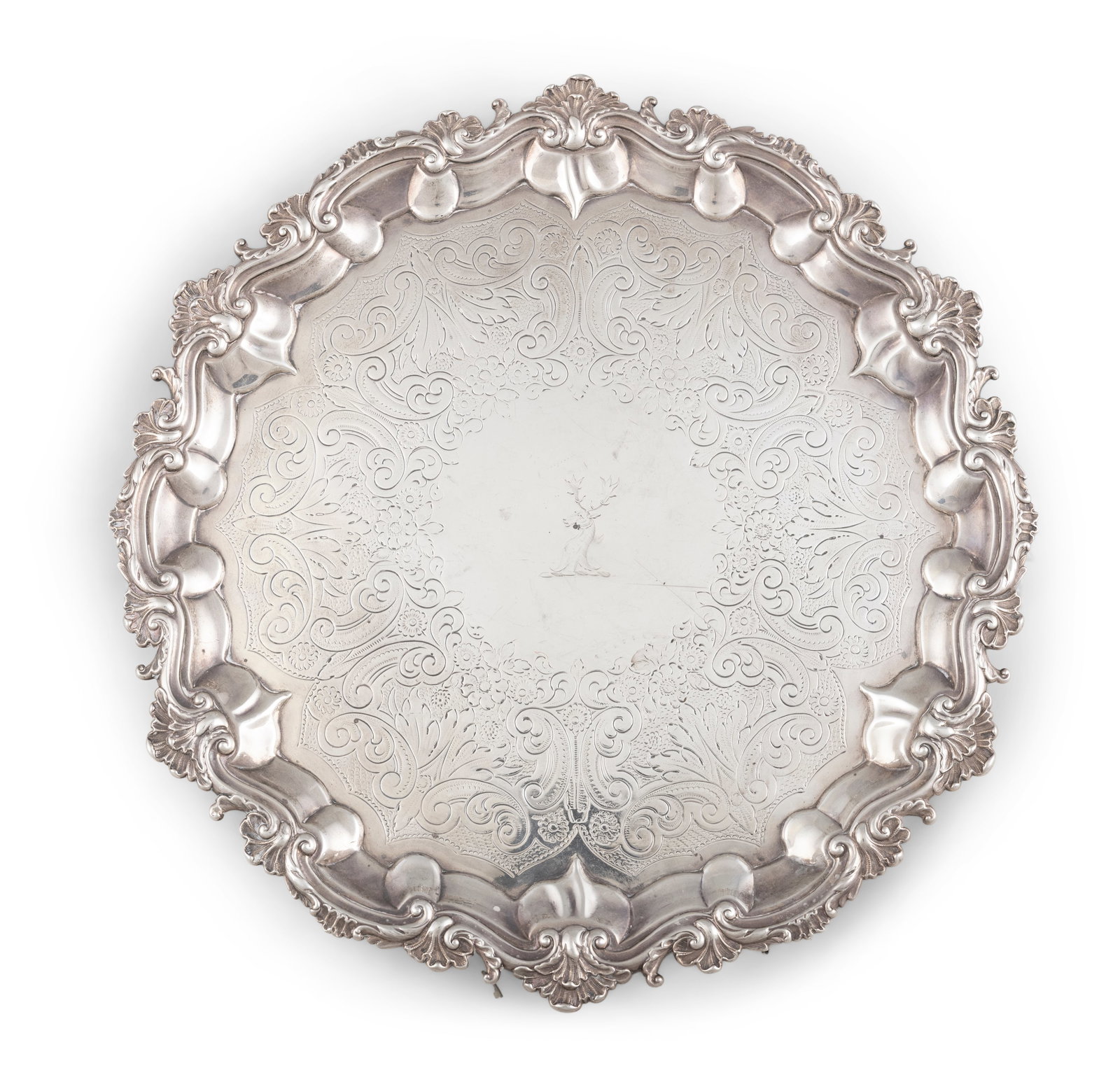 A GEORGE III SILVER SALVER, London 1809, maker's mark of Henry Chawner, of shaped circular form,: A GEORGE III SILVER SALVER, London 1809, maker's mark of Henry Chawner, of shaped circular form, with raised pie-crust rim cast with scallops and scrollwork, the central reserve with stag head crest, 