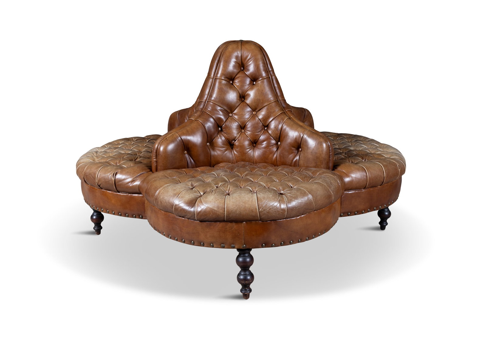 A CONTEMPORARY BUTTON BACK CONVERSATION SEAT, in four sections, upholstered in close nailed brown (1 of 5)