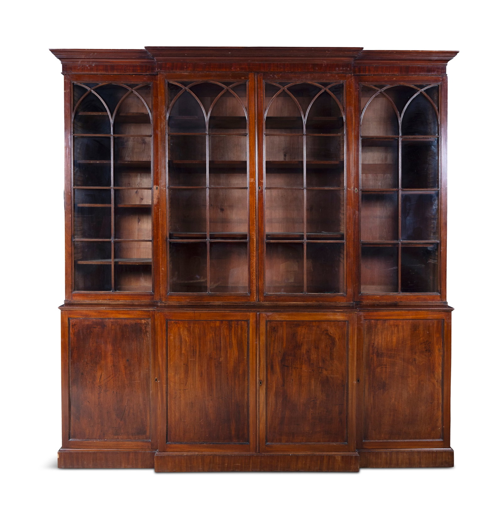 A 19TH CENTURY BREAKFRONT MAHOGANY BOOKCASE, the moulded cornice above four astragal doors of (1 of 8)