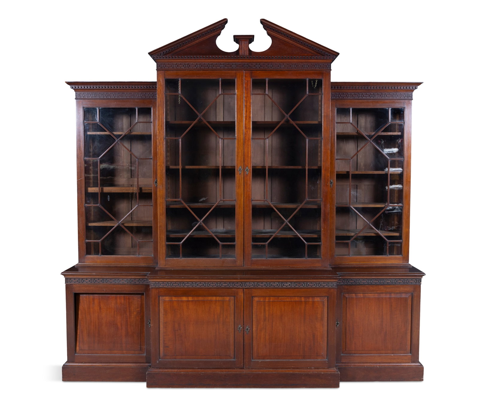 A MAHOGANY FOUR DOOR BREAKFRONT BOOKCASE, 19th CENTURY the architectural pediment above a band of (1 of 6)