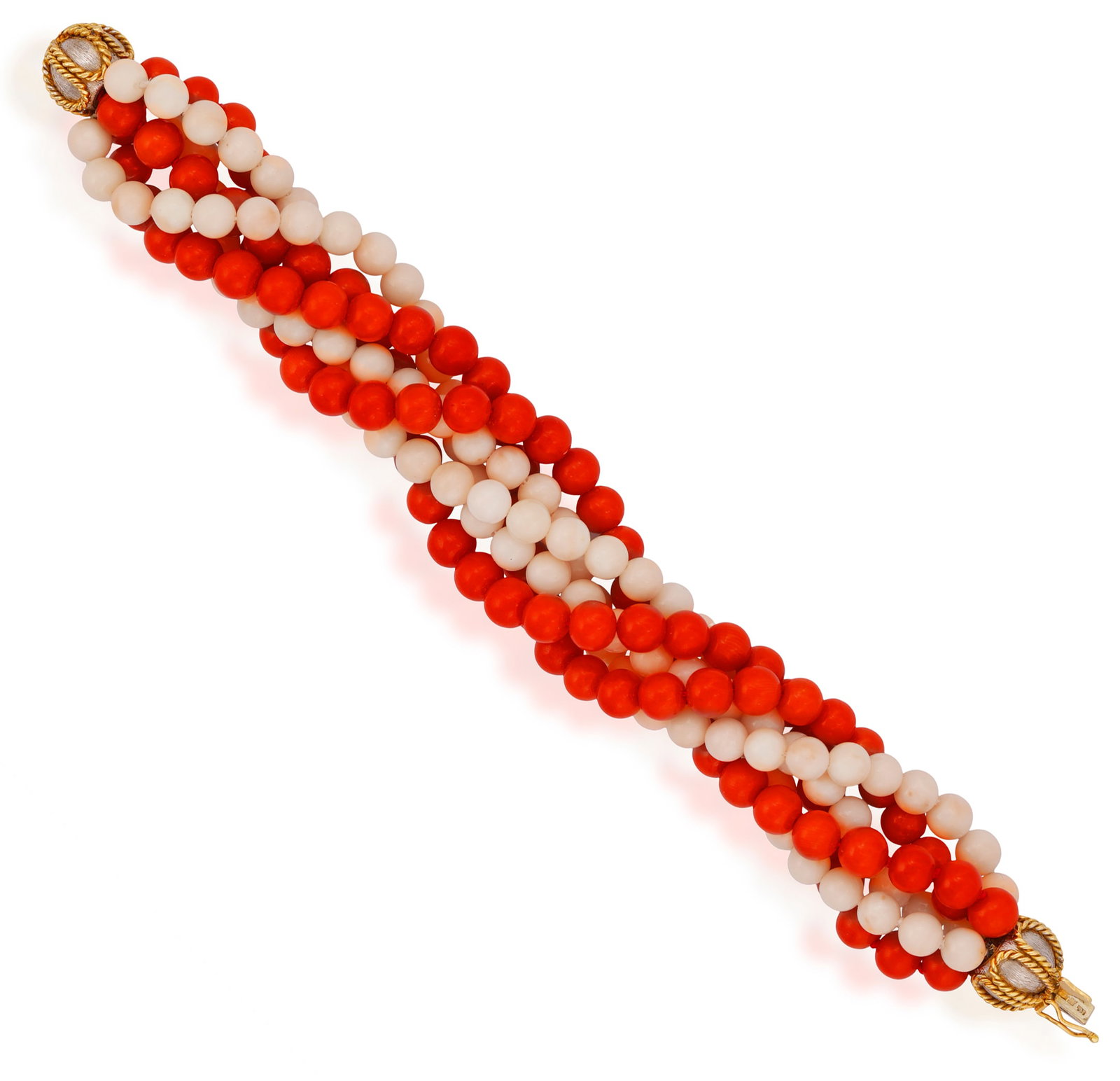 A CORAL AND GOLD BRACELET, CIRCA 1970 Of torsade design, set with six strands of red and angel's: A CORAL AND GOLD BRACELET, CIRCA 1970 Of torsade design, set with six strands of red and angel's skin coral beads, united by a bi-coloured 18K gold bombé clasp decorated with ropetwist detailing 