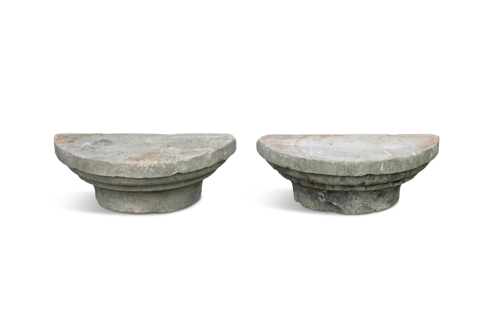 A PAIR OF LIMESTONE PILASTER BASES, of stepped demi-lune form. 55cm wide, 25cm diameter, 20cm high (1 of 3)