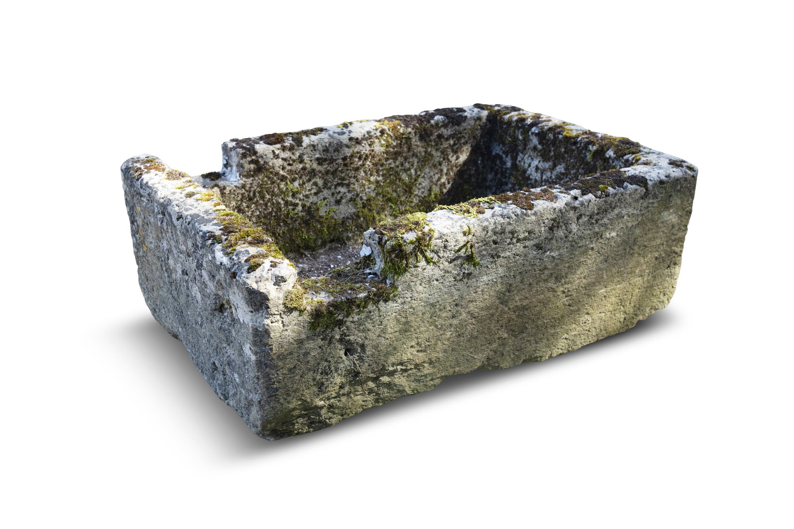 A LIMESTONE TROUGH, of rectangular form, with cut out sections for water pipe. 31cm high, 91cm wide (1 of 2)