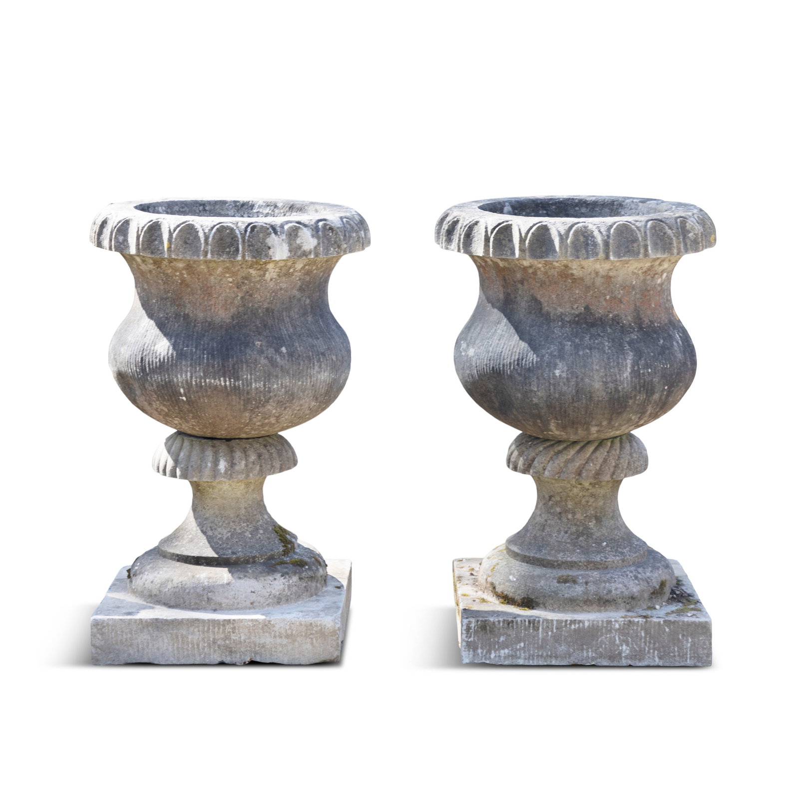 A PAIR OF CARVED LIMESTONE URNS, 18TH CENTURY, each of baluster form, with out turned with egg and (1 of 3)
