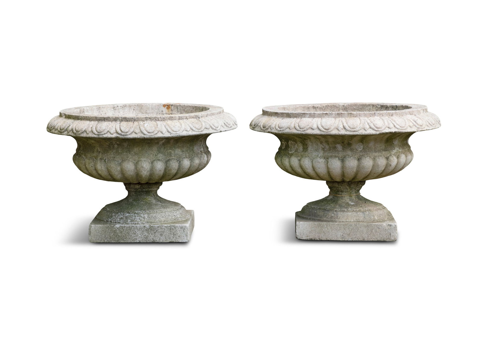 A PAIR OF CAMPAGNA URN PLANTERS, of compressed form, with out turned egg and dart rims,: A PAIR OF CAMPAGNA URN PLANTERS, of compressed form, with out turned egg and dart rims, demi-fluted body, socle base and square platform, 59cm diameter, 41cm high