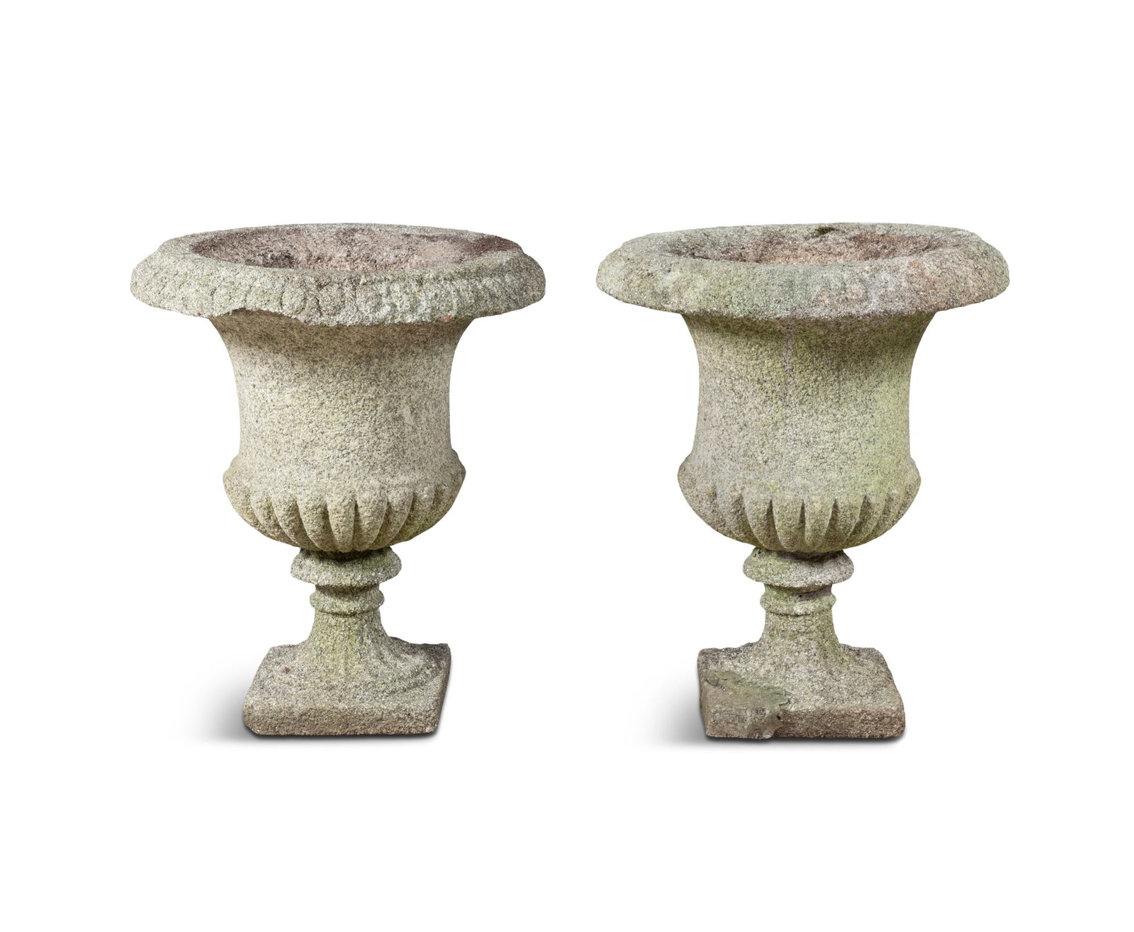 A PAIR OF GRANITE GARDEN URNS, 19TH CENTURY, of campagna form, outturned rims, demi-fluted bodies: A PAIR OF GRANITE GARDEN URNS, 19TH CENTURY, of campagna form, outturned rims, demi-fluted bodies over waisted socles and square plinth bases.74cm high x 62cm diameter