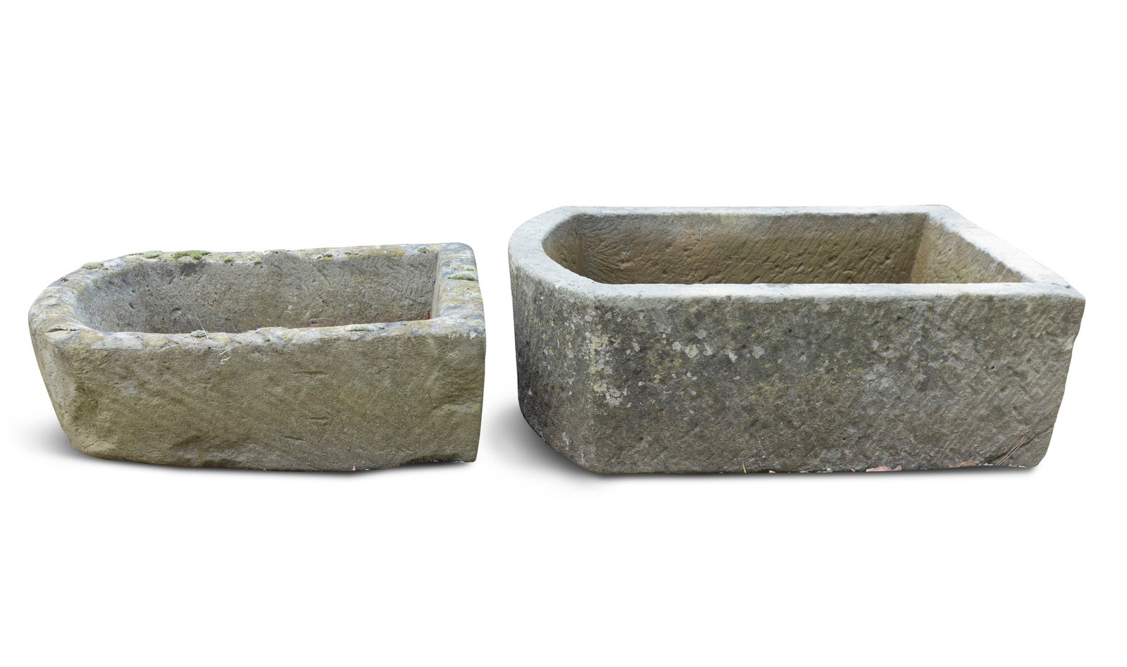 TWO CARVED IRISH 18TH CENTURY LIMESTONE TROUGHS, Each of subtly arched shape with drainage hole to: TWO CARVED IRISH 18TH CENTURY LIMESTONE TROUGHS, Each of subtly arched shape with drainage hole to each (i) 20cm high x 72cm long x 49cm wide (ii) 20cm high x 58cm long x 40cm wide