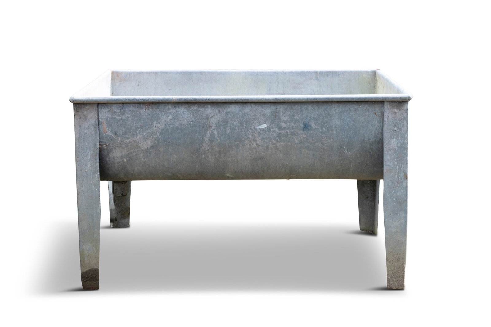 A GALVANISED ZINC TROUGH, The deep reserve with drainage hole and supported by four legs, 73cm: A GALVANISED ZINC TROUGH, The deep reserve with drainage hole and supported by four legs, 73cm high, 126cm long, 65.5cm wide Provenance: Private Collection, Kerry