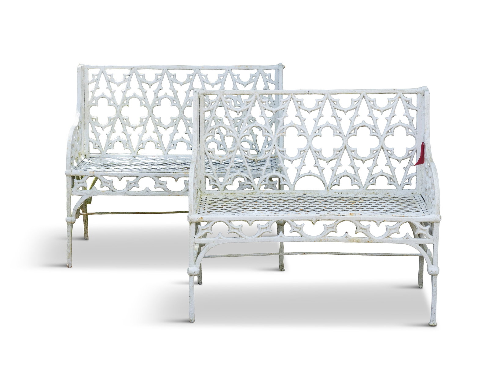 A PAIR OF VICTORIAN, WHITE PAINTED CAST IRON TWO-SEATER GARDEN BENCHES, in the Gothic taste, the: A PAIR OF VICTORIAN, WHITE PAINTED CAST IRON TWO-SEATER GARDEN BENCHES, in the Gothic taste, the openwork back and sides with trefoils and arches on squared legs, 86cm high, 98cm wide, 46cm deep, 45cm