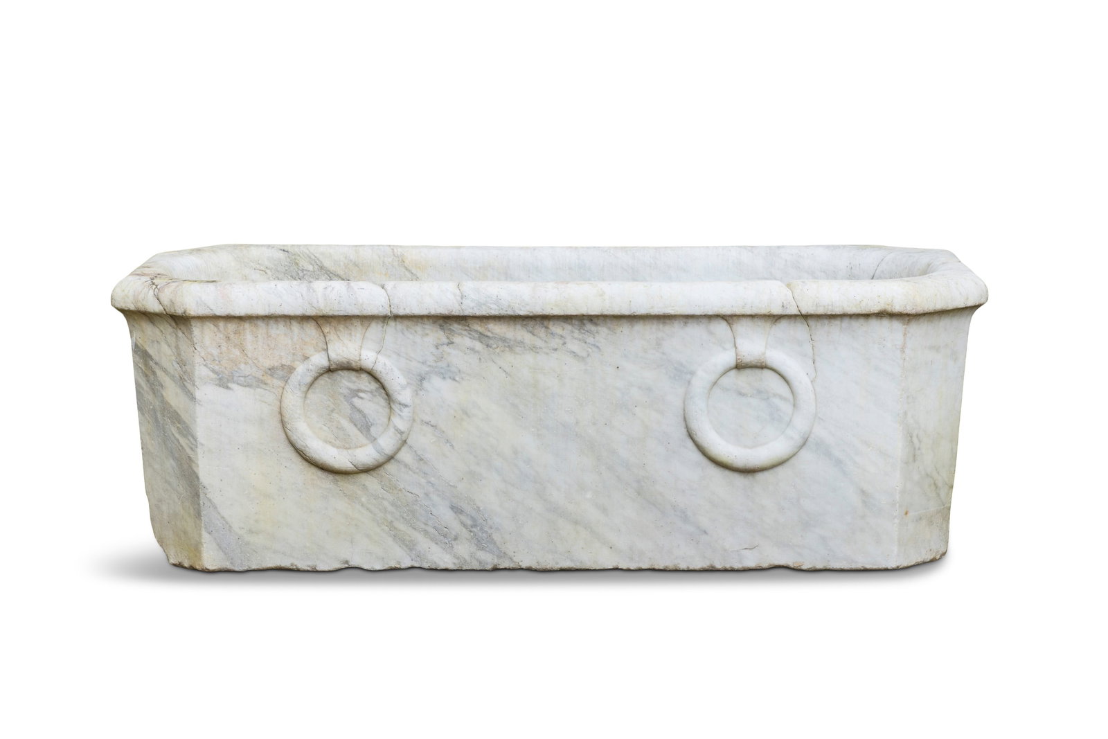 AN ITALIAN GRAND TOUR CARVED CARRARA MARBLE BATHTUB, 18TH CENTURY, in the classical taste the: AN ITALIAN GRAND TOUR CARVED CARRARA MARBLE BATHTUB, 18TH CENTURY, in the classical taste the roll-top effect top above an octagonal faceted basin, the exterior carved with two large rings on one side