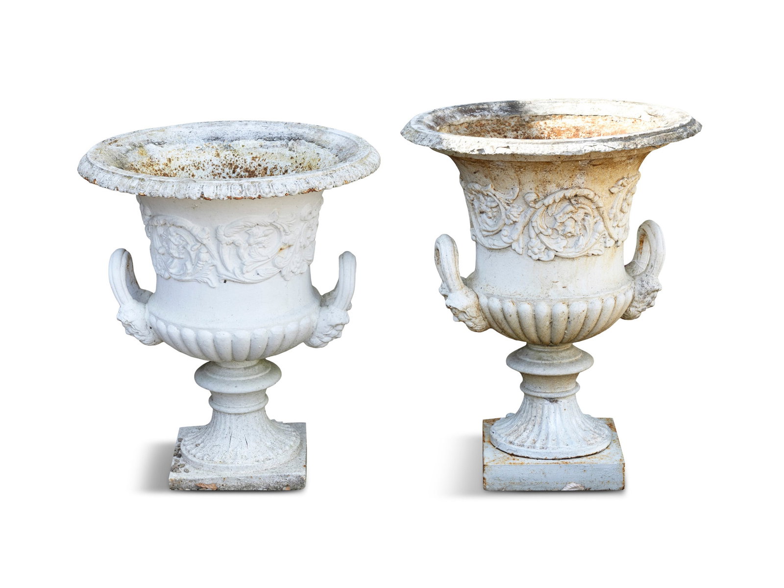 A PAIR OF LARGE WHITE PAINTED CAST-IRON AMPHORA URN PLANTERS, the floral rims above a band of: A PAIR OF LARGE WHITE PAINTED CAST-IRON AMPHORA URN PLANTERS, the floral rims above a band of moulded foliate detail and the waisted reserve flanked by upturned ring handles, above a gadrooned lower s