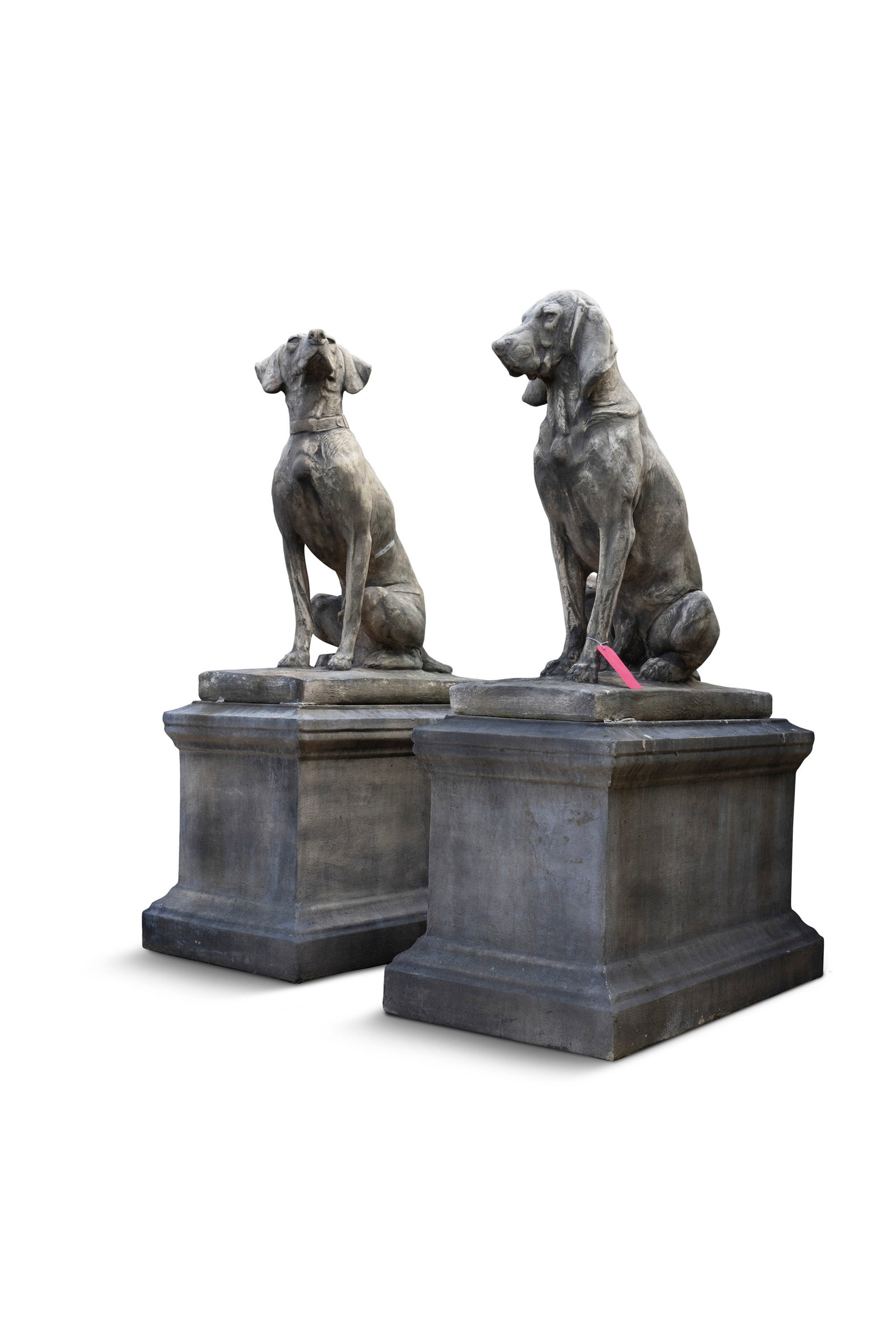 A PAIR COMPOSITE STONE FIGURES OF SEATED HOUNDS, resting on rectangular pedestals, c.153cm high (1 of 2)