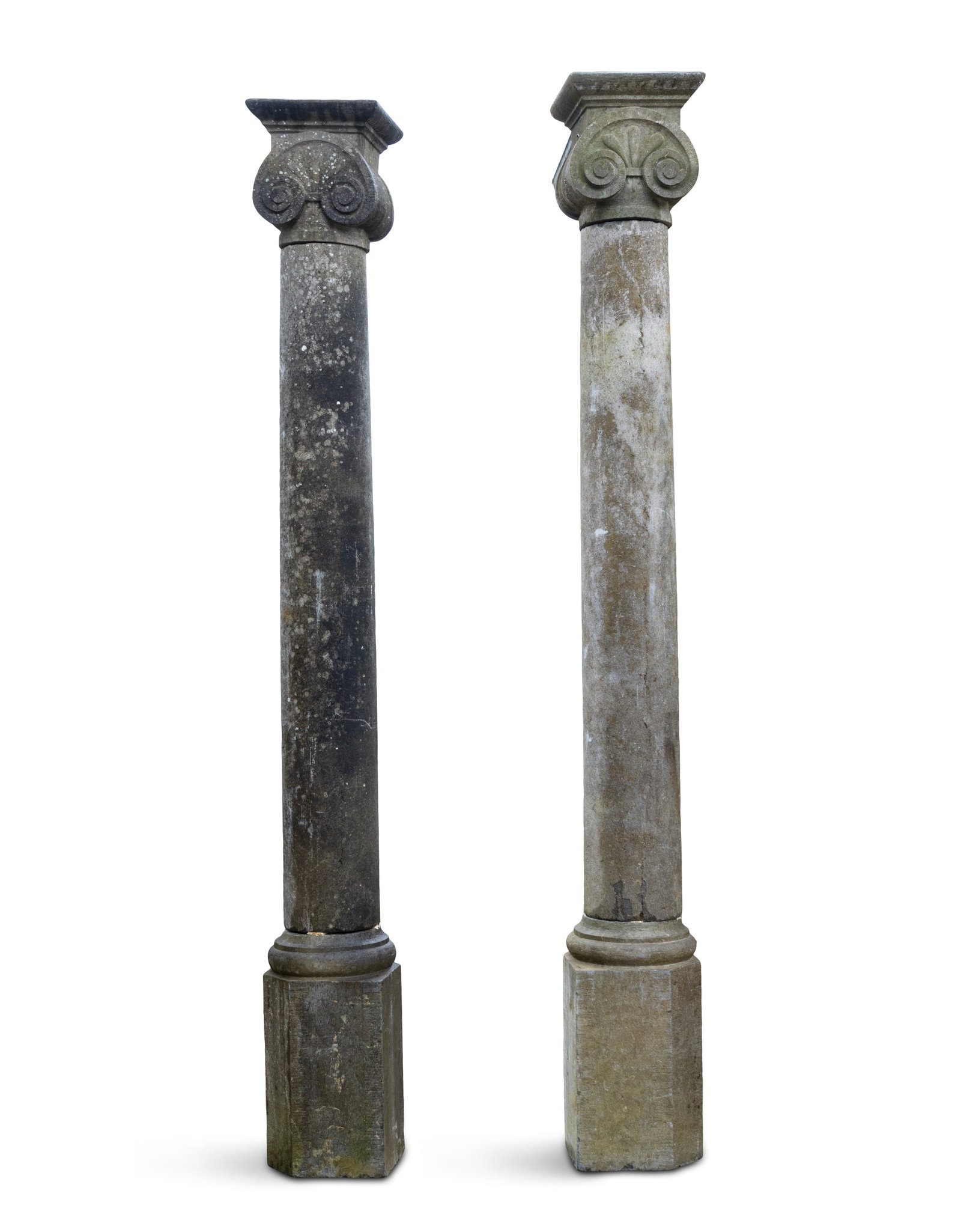 A PAIR OF LIMESTONE ICONIC COLUMNS, flat capitals on carved pedestal bases. 222 x 52cm in its: A PAIR OF LIMESTONE ICONIC COLUMNS, flat capitals on carved pedestal bases. 222 x 52cm in its entirety, columns 221cm, base 52cm