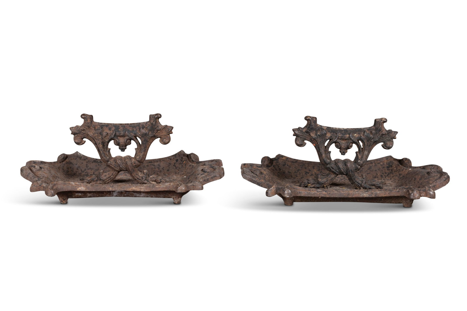 A PAIR OF 19TH CENTURY, CAST METAL BOOT SCRAPERS, shaped pans, scrollwork, central section, 19cn (1 of 2)