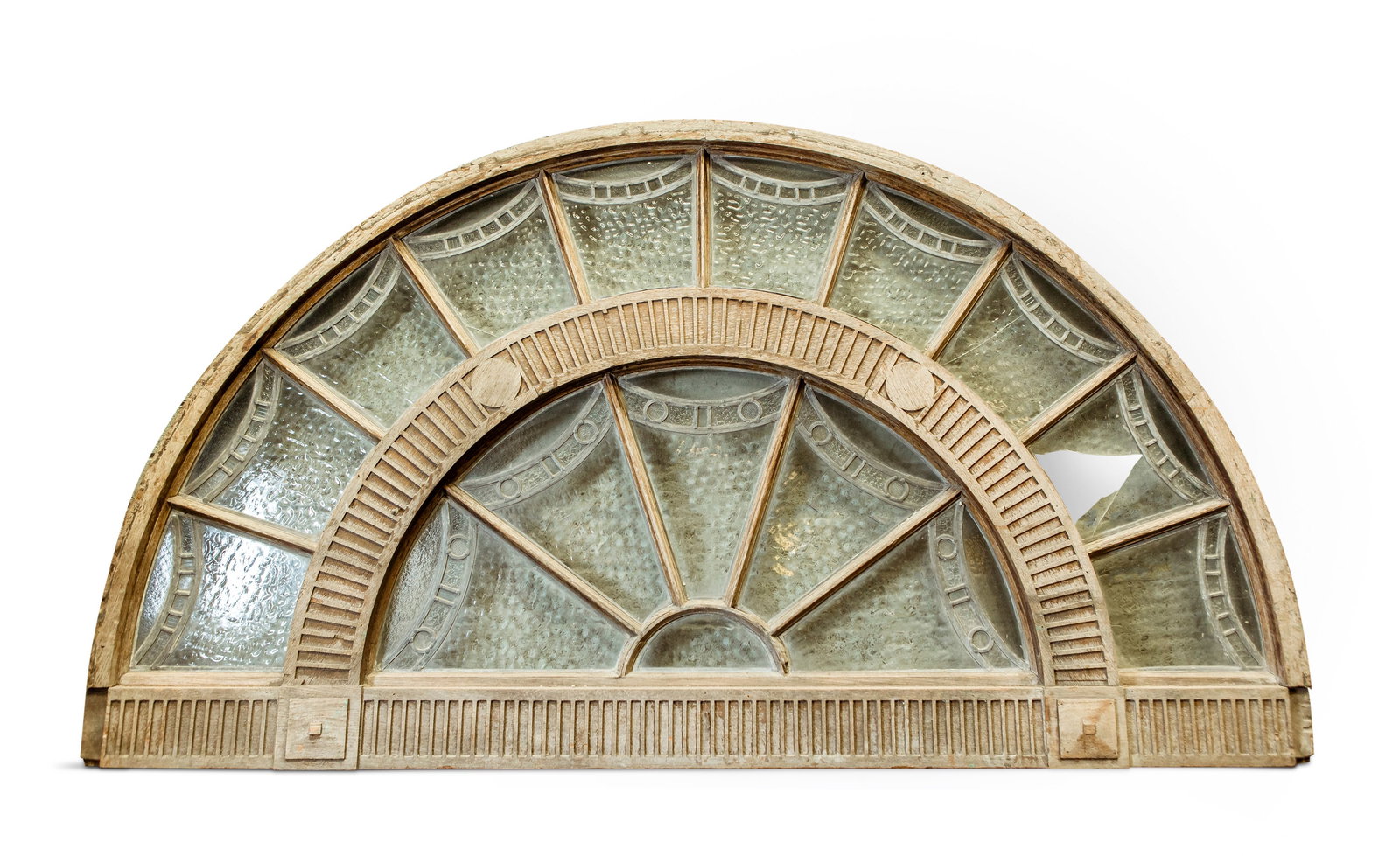 A MONUMENTAL GEORGE III STYLE OAK AND LEAD FAN LIGHT, 19TH CENTURY, the radiating lucite glazed: A MONUMENTAL GEORGE III STYLE OAK AND LEAD FAN LIGHT, 19TH CENTURY, the radiating lucite glazed and frosted sections within a central carved fluted arch and base, 136cm high, 236cm wide, 10cm deep
