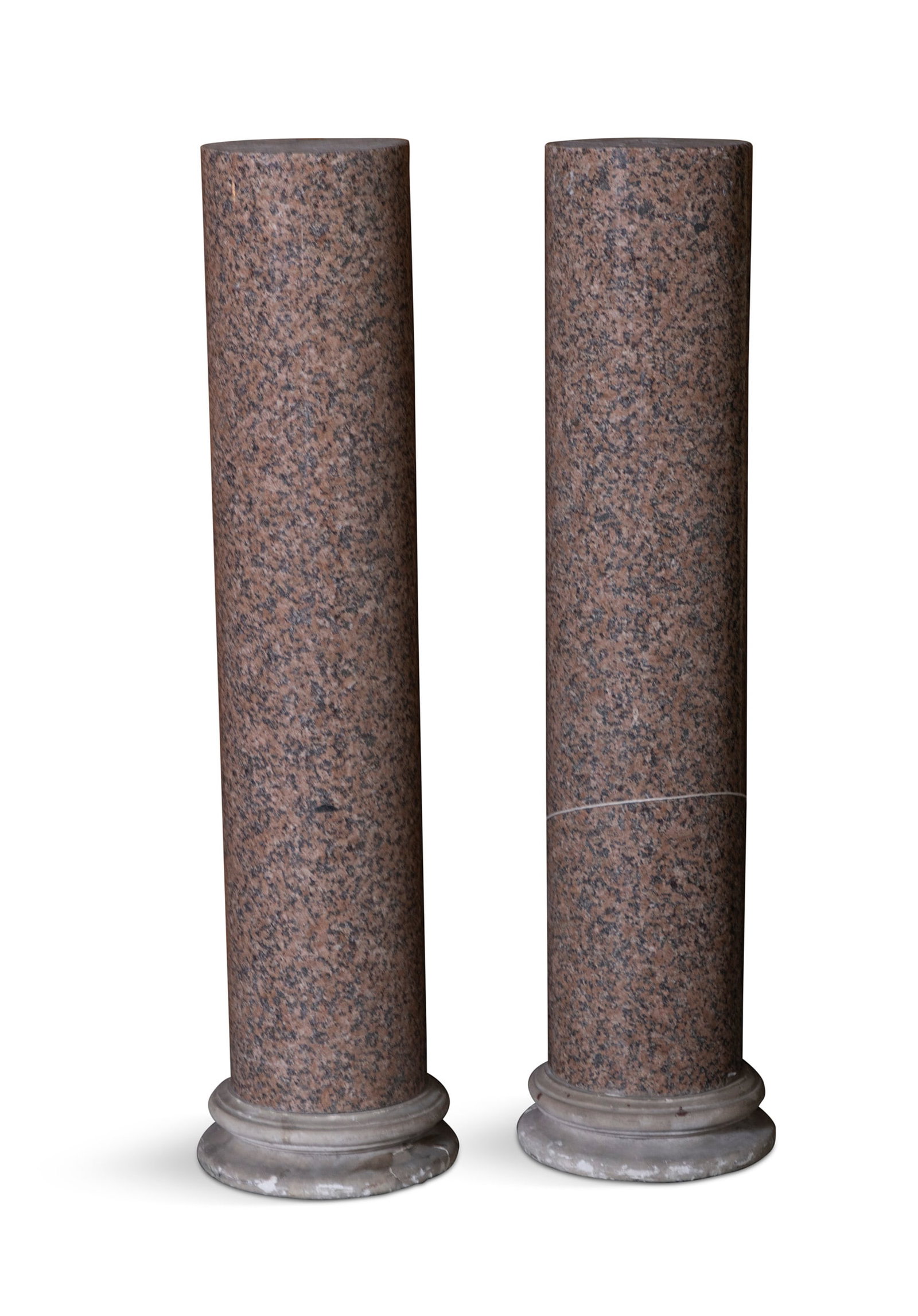 A PAIR OF GRANITE COLUMNS, on Portland stone circular bases. 99cm high, 19.5cm diameter: A PAIR OF GRANITE COLUMNS, on Portland stone circular bases. 99cm high, 19.5cm diameter