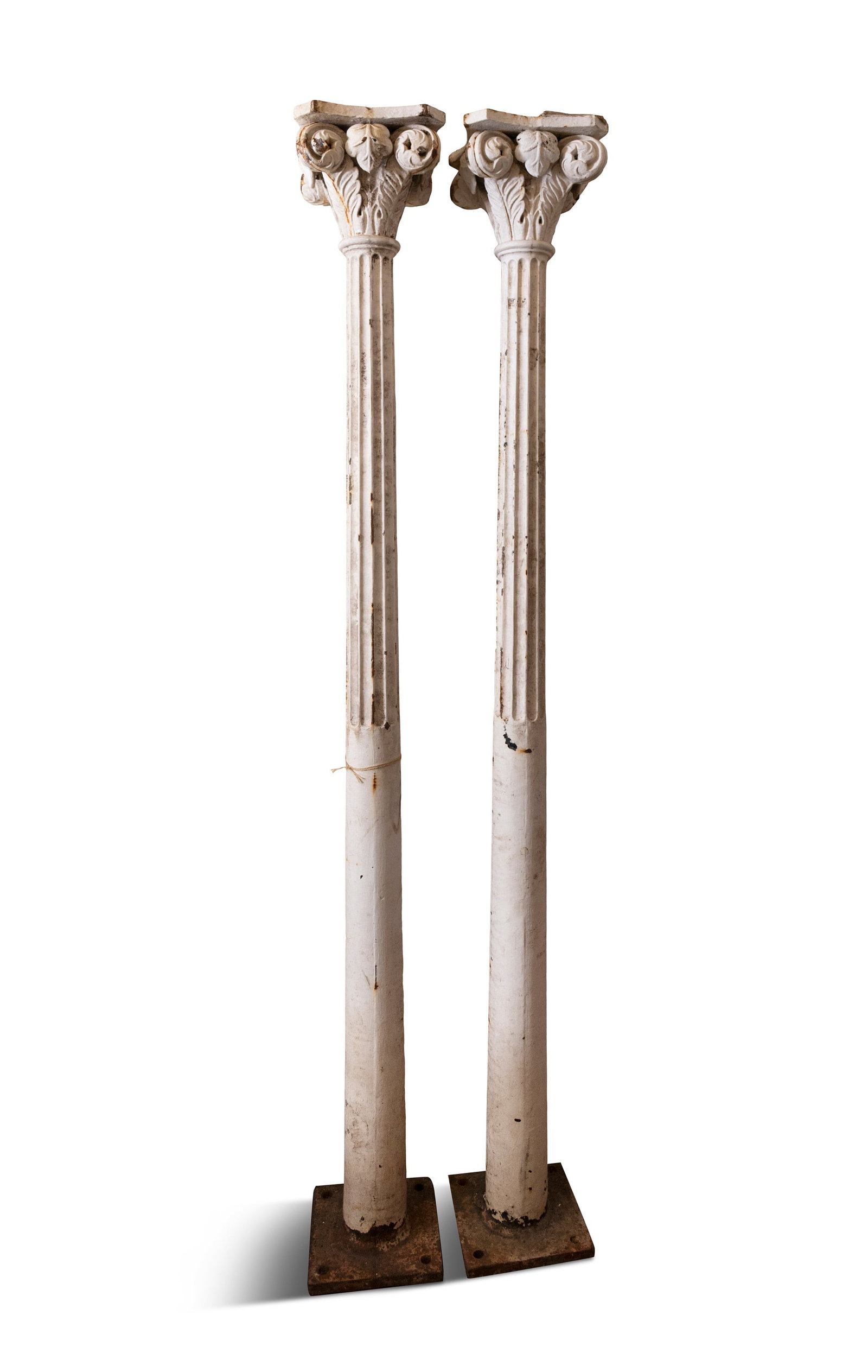 A PAIR OF 19TH CENTURY CAST IRON WHITE PAINTED COLUMNS, shaped capitals over scroll and acanthus: A PAIR OF 19TH CENTURY CAST IRON WHITE PAINTED COLUMNS, shaped capitals over scroll and acanthus leaf frieze, demi fluted bodies, 246cm high