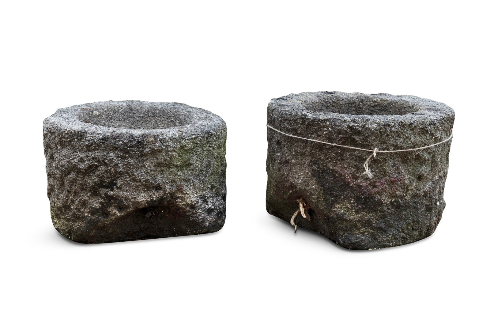 TWO CARVED GRANITE TROUGHS OF CYLINDRICAL FORM, c.46cm wide, 33cm high c.46cm wide, 30cm high (1 of 4)