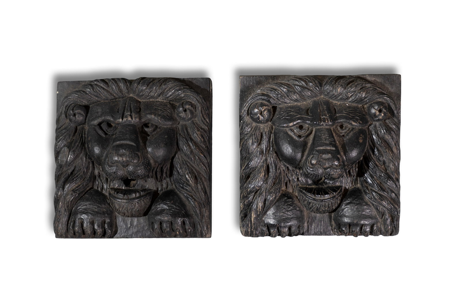 A PAIR OF TIMBER LION MASK PLAQUES 16cm x 15cm (1 of 3)